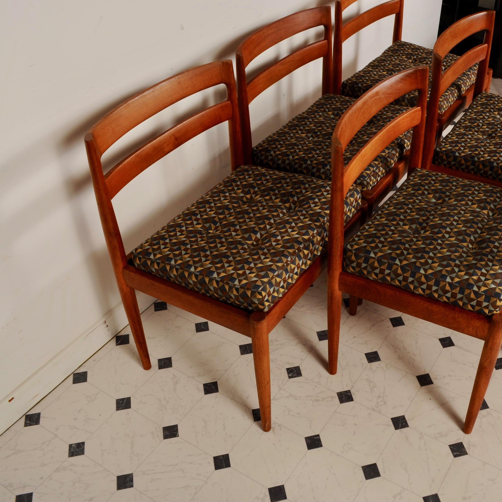Nice clean set of side chairs, model 301 / Universe, designed by Kai Kristiansen. Produced by Magnus Olesen in Denmark. Almost all model 301 chairs were made in rosewood. This set of six in teak is super rare. Clean, recently upholstered seat