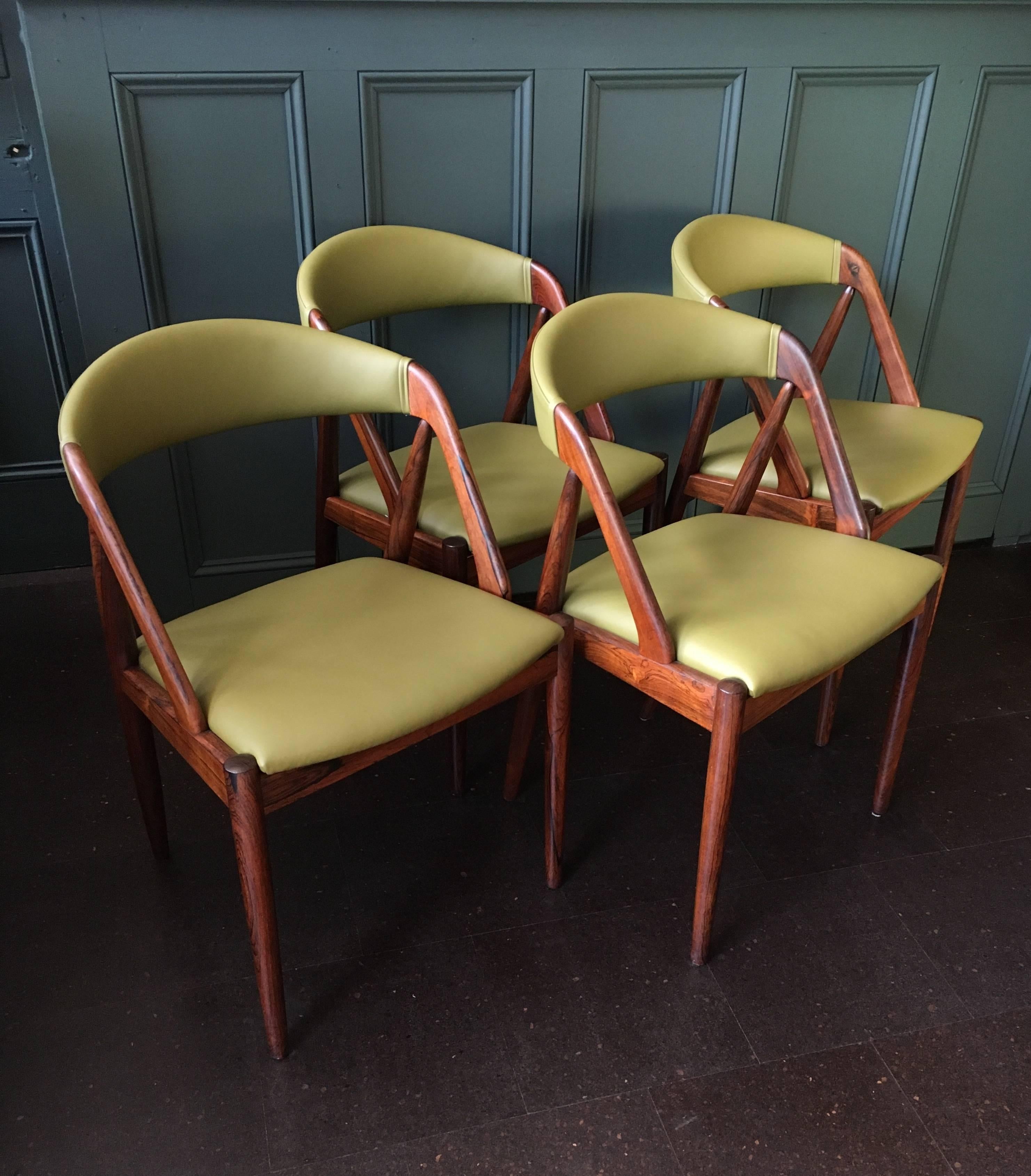 Fully refurbished and re-upholstered Kai Kristiansen model 31 dining chairs, Denmark, 1960. 
Wonderful new olive Italian leather to contrast the Santos rosewood frames. Rare examples. 
We have more in stock. 
Custom upholstery is available.
Please