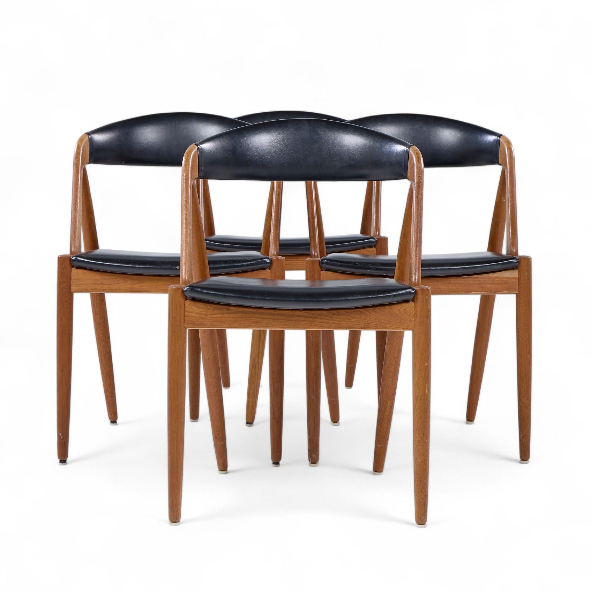 Kai Kristiansen Model 31 Mid Century Danish Teak Dining Chairs - Set of 4

Each chair measures: 19.5 wide x 20 deep x 29.5 inches high, with a seat height/chair clearance of 17.5 inches

We take our photos in a controlled lighting studio to show as