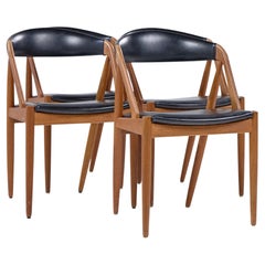 Kai Kristiansen Modelo 31 Sillas de comedor danesas de teca de mediados de siglo - Juego de 4