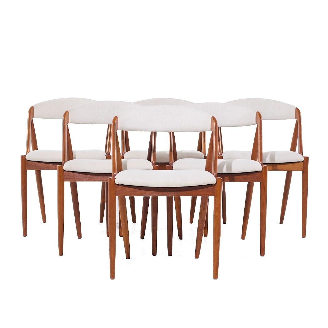 Kai Kristiansen Modelo 31 Sillas de comedor danesas de teca de mediados de siglo - Juego de 6

Cada silla mide 19,5 de ancho x 18,5 de fondo x 29,5 pulgadas de alto, con una altura del asiento/holgura de la silla de 18,5 pulgadas

Todos los muebles