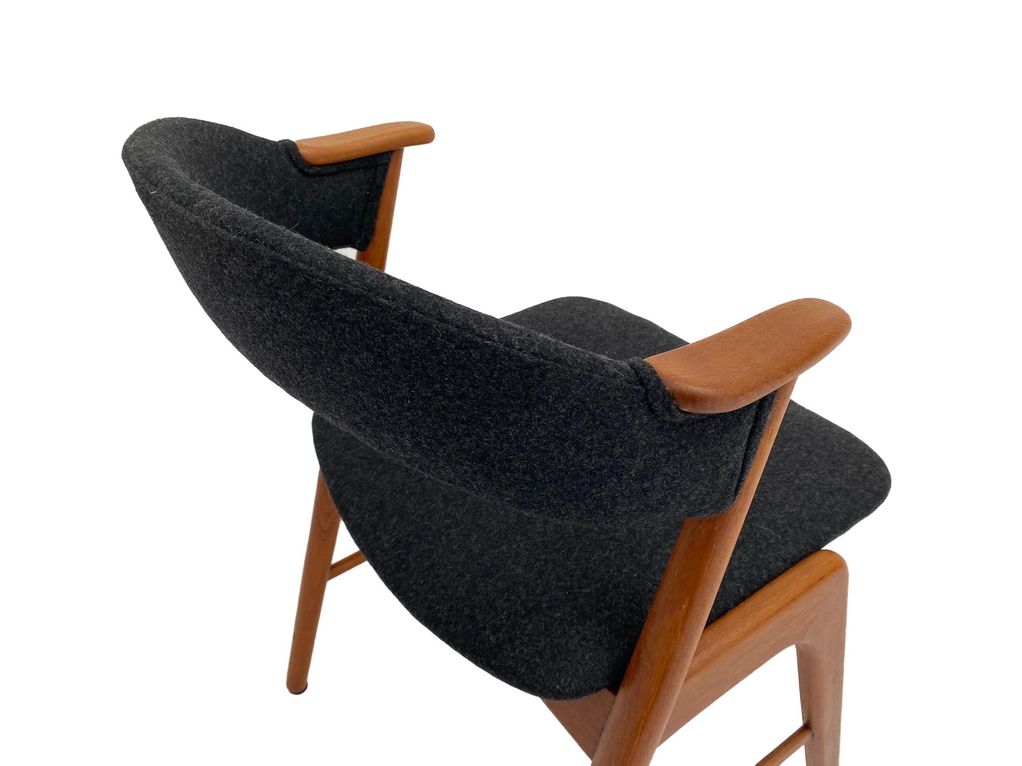 A rare Model 32 charcoal and teak desk armchair designed by Kai Kristiansen for Korup Stolefabrik, this would make a stylish addition to any living or work area.

The Model 32 chair is a testament to Kristiansen's ability to meld style and