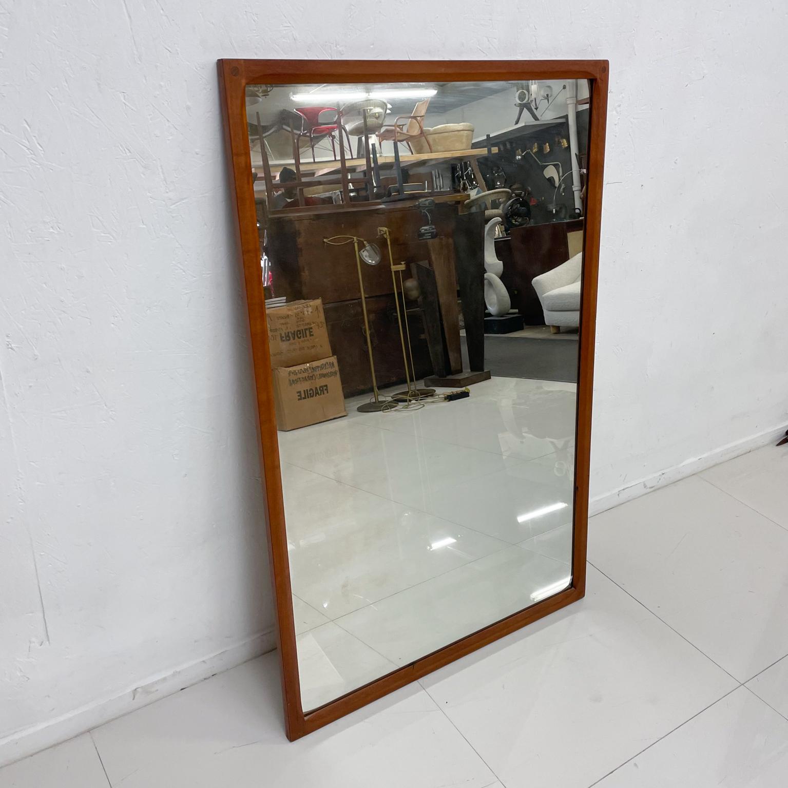 For your consideration:
from designer Kai Kristiansen teak wall mirror manufactured by Aksel Kjersgaard A/S Odder, Denmark Scandinavian Modern
Lovely midcentury modern clean minimalism. Tight joinery featuring a circular inset within the