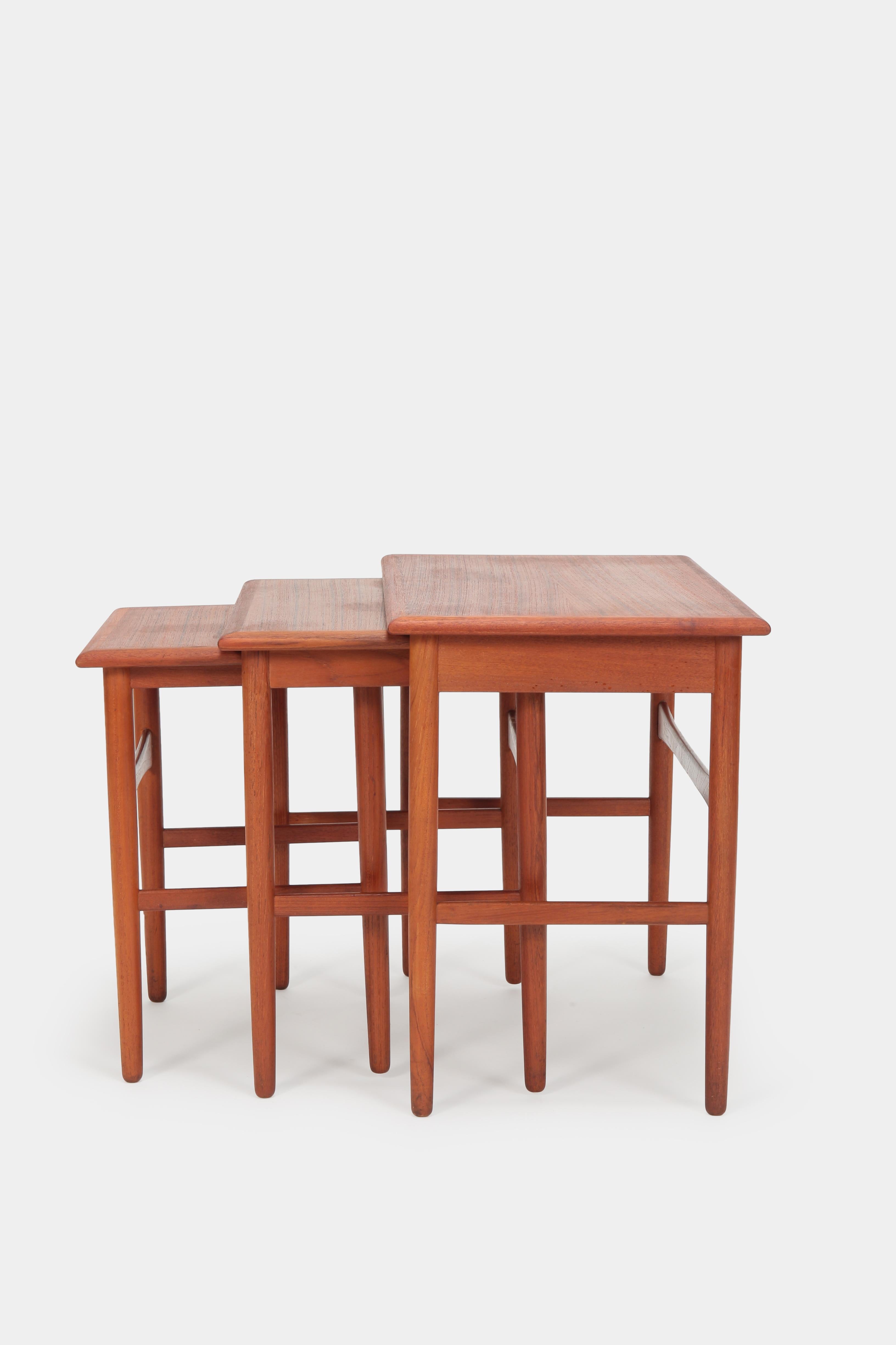 Kai Kristiansen nesting tables by MH Møbler in the 1960s in Denmark, Svendborg. Three nesting tables made of solid teak wood in very good condition.