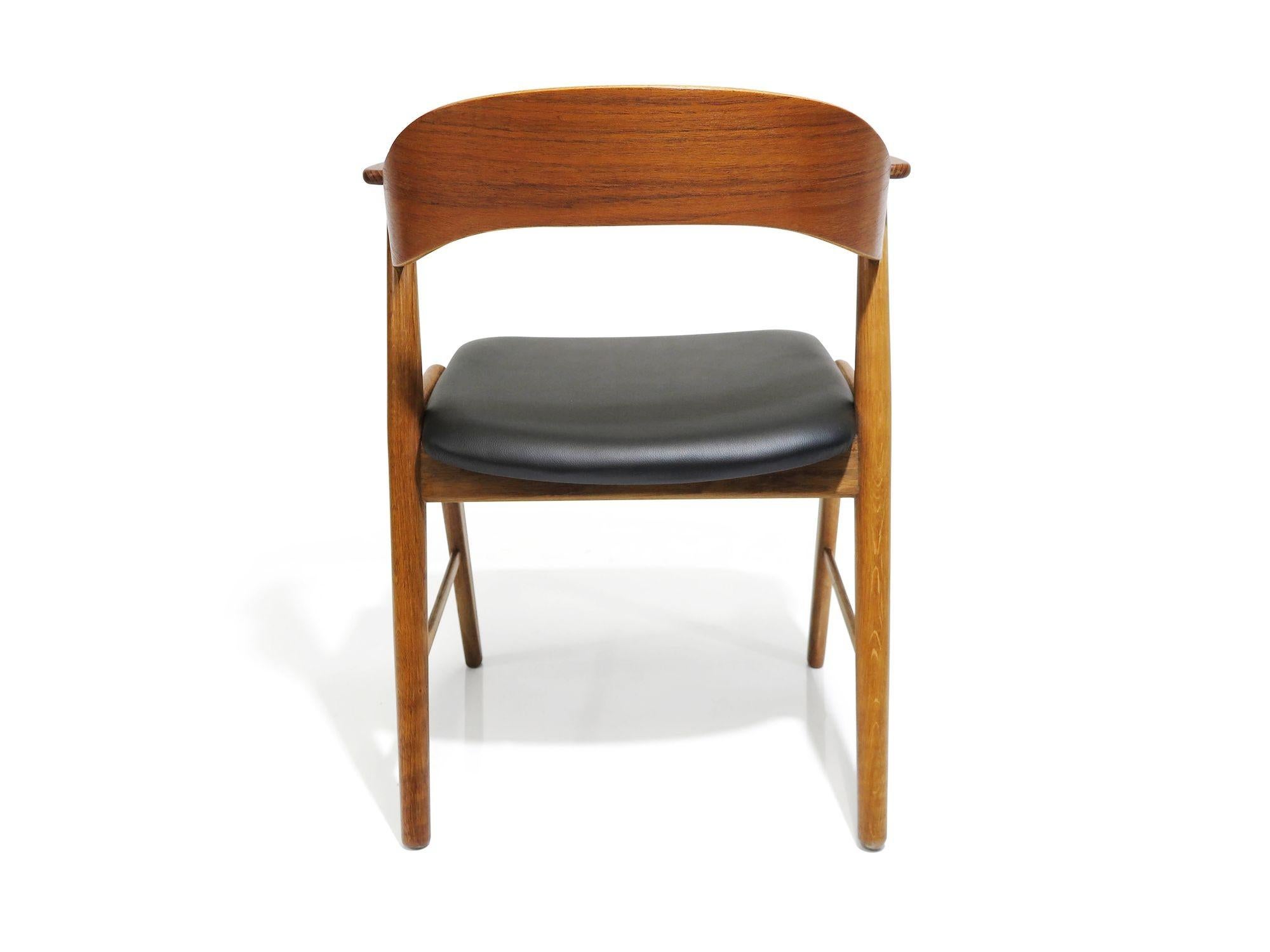 Scandinavian Modern Kai Kristiansen Oak and Teak Curved Back Dining Chairs For Sale