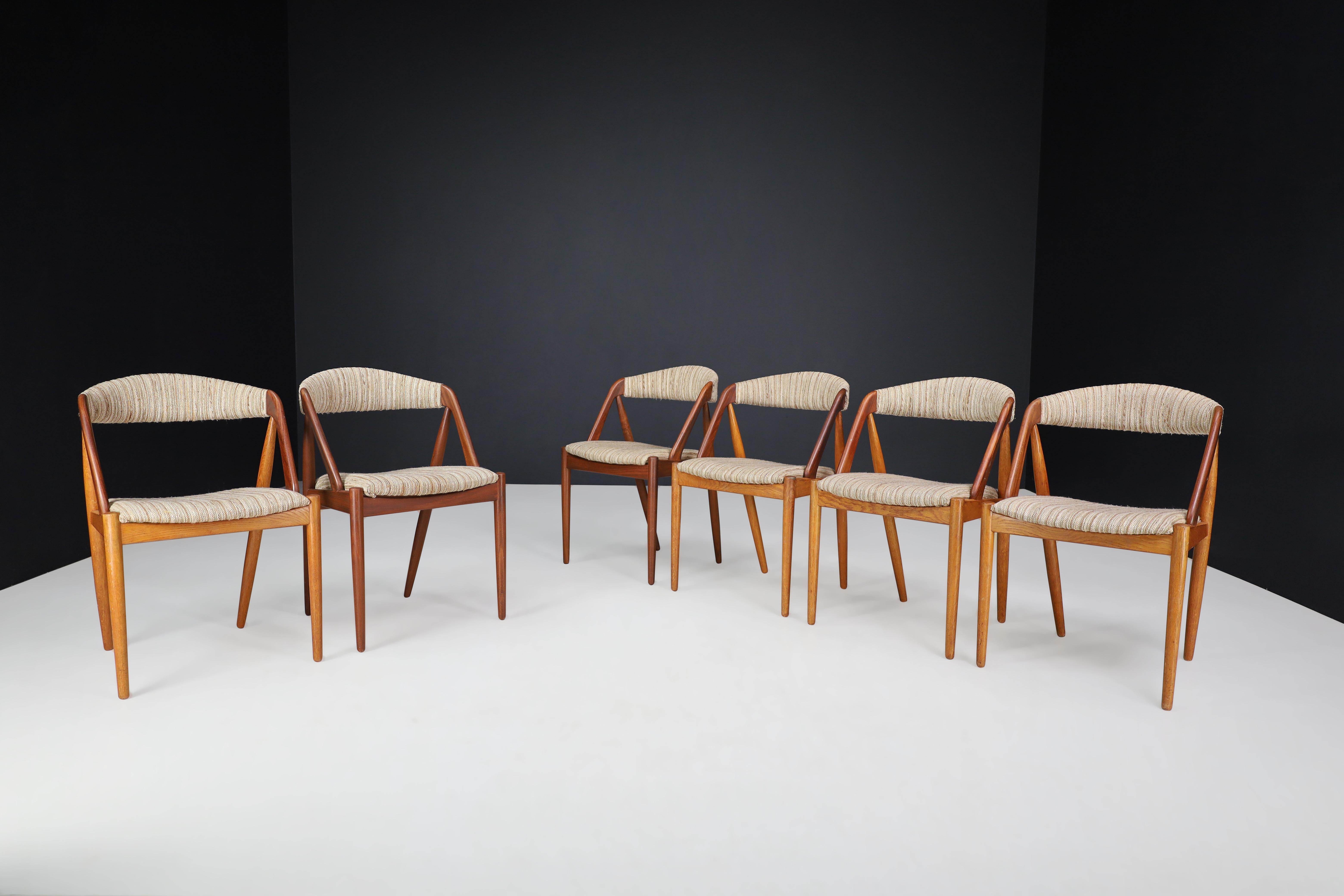 Kai Kristiansen oak dining chairs set/6, Denmark, 1960s 

Model 31 Dining Chairs by Kai Kristiansen, Denmark, 1960s. Model 31 is one of the most well-known chairs designed by Kai Kristiansen - a true Classic with its curved backrest, crooked