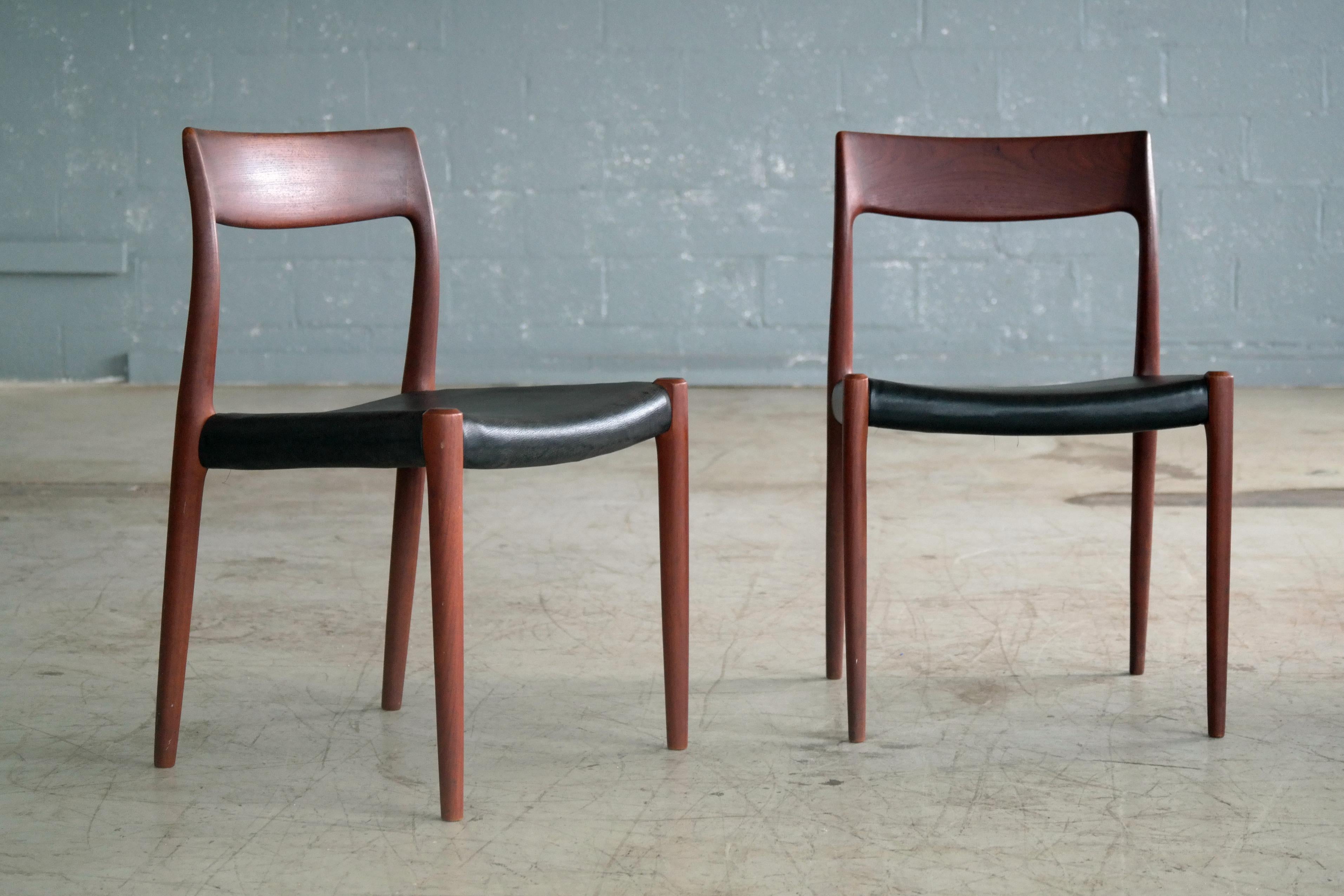 Fantastic pair of dining or side chairs in dark teak with leather seats designed in the 1960s by Kai Kristiansen for K.S. Mobler of Denmark. The style of the Kai Kristiansen chairs is easily mistaken for N. O Moller and they are of a very