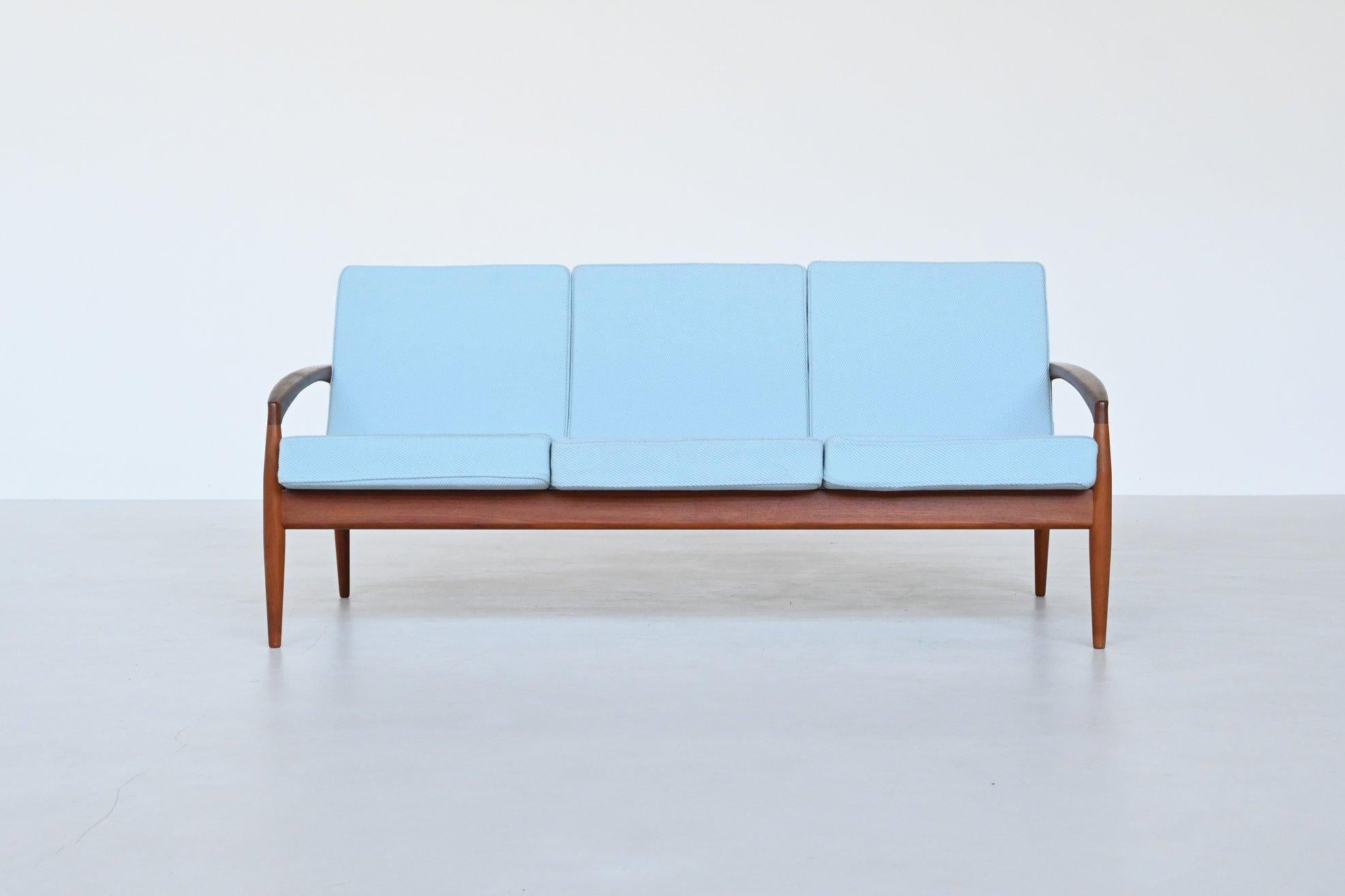Beautiful elegant shaped three-seat sofa model Paper Knife no. 121 designed by Kai Kristiansen and manufactured by Magnus Olesen, Denmark 1956. This sculpted sofa features a solid teak wooden frame and the cushions are upholstered with high-quality