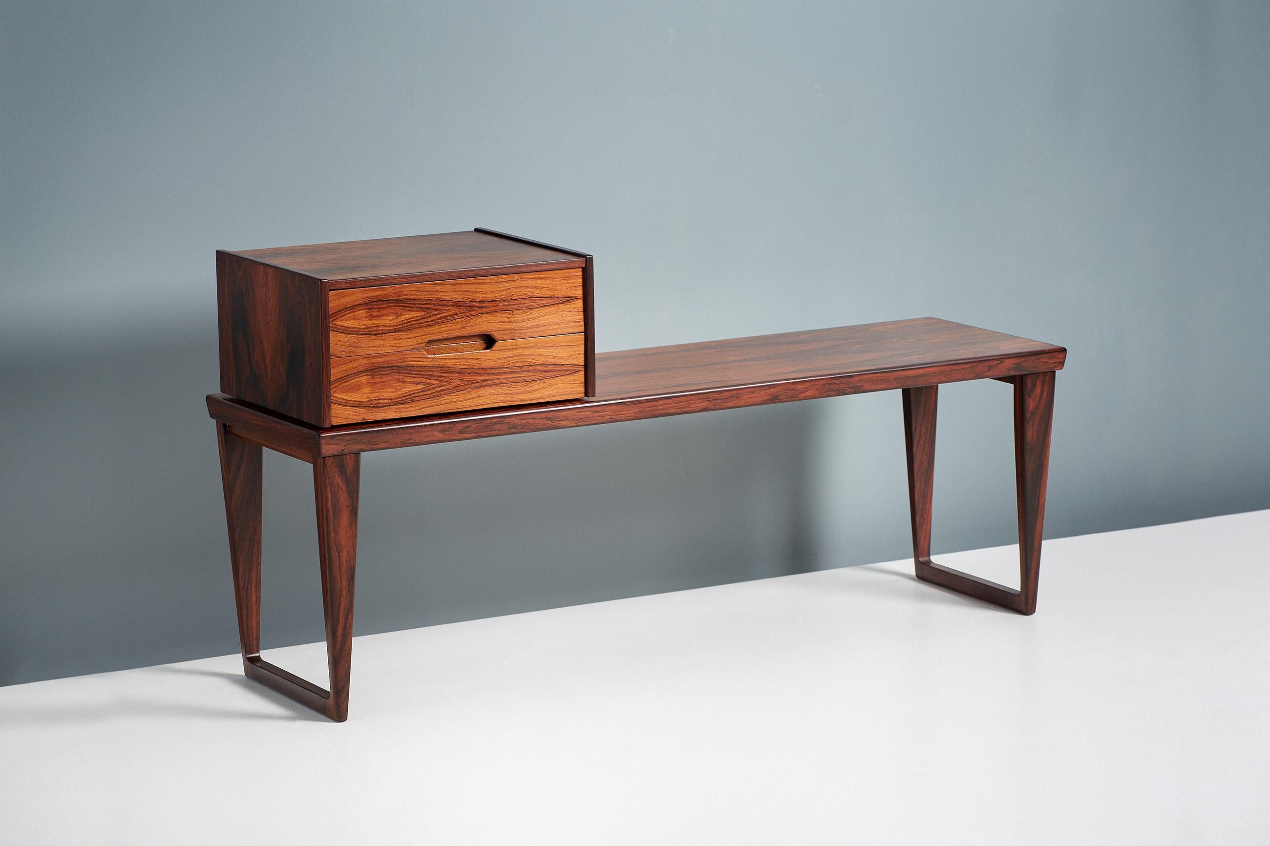 Stunning, exotic grained rosewood bench with matching, loose standing two-drawer unit which can be positioned anywhere along the bench surface. This piece was designed by Danish design icon Kai Kristiansen and produced by Aksel Kjersgaard in Odder,