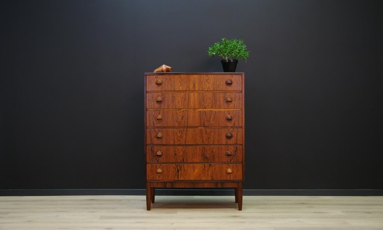 Fantastic chest of drawers from the 1960s-1970s, form designed by Kai Kristiansen - Danish design. The surface is veneered with rosewood. Six capacious drawers with original handles made of solid rosewood. Item does not have a key. Preserved in good