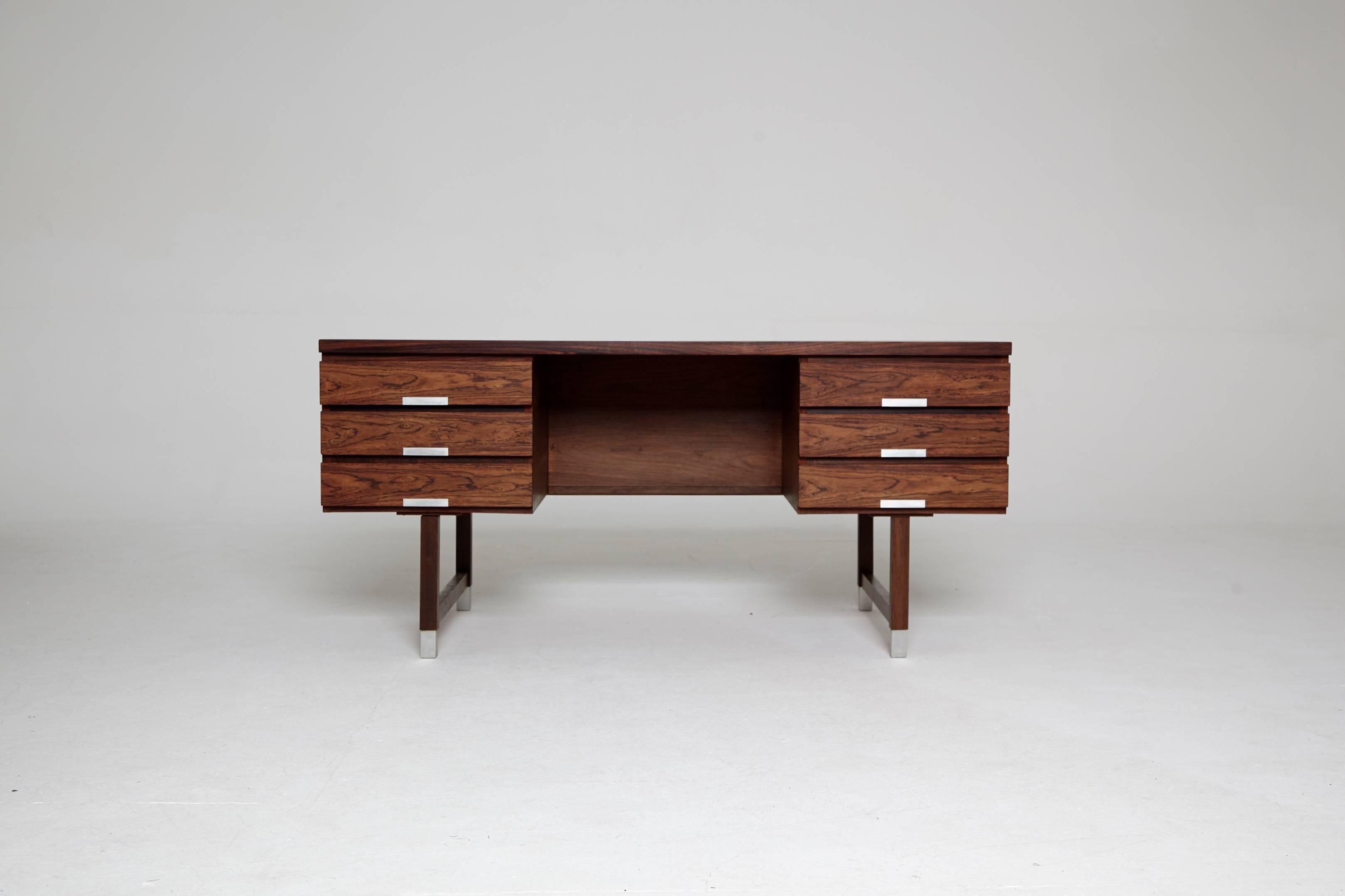 Midcentury rosewood writing desk by Kai Kristiansen, 1960s, Denmark. Front with six drawers, reverse side with shelves. Aluminum handles and shoes. In good original condition. Ships worldwide.
  
  