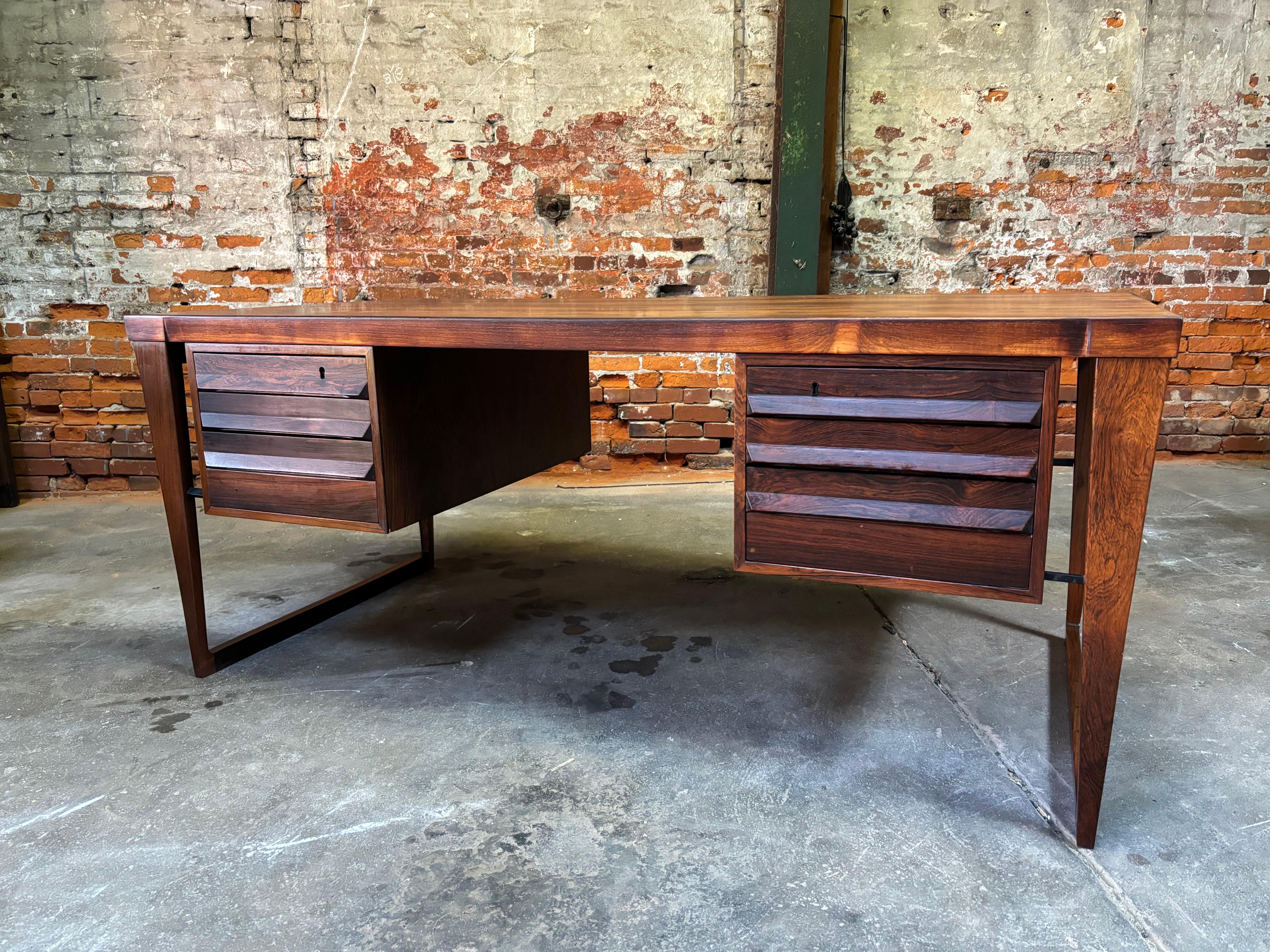 Beautiful Kai Kristiansen Rosewood Desk with locking drawers and front cabinets!  Desk opening is 24.5 wide and 26.5 high.  Sled Style Runner Legs.  One of Kristiansen's finest and most iconic designs.  Hard to find in Rosewood!  Top newly