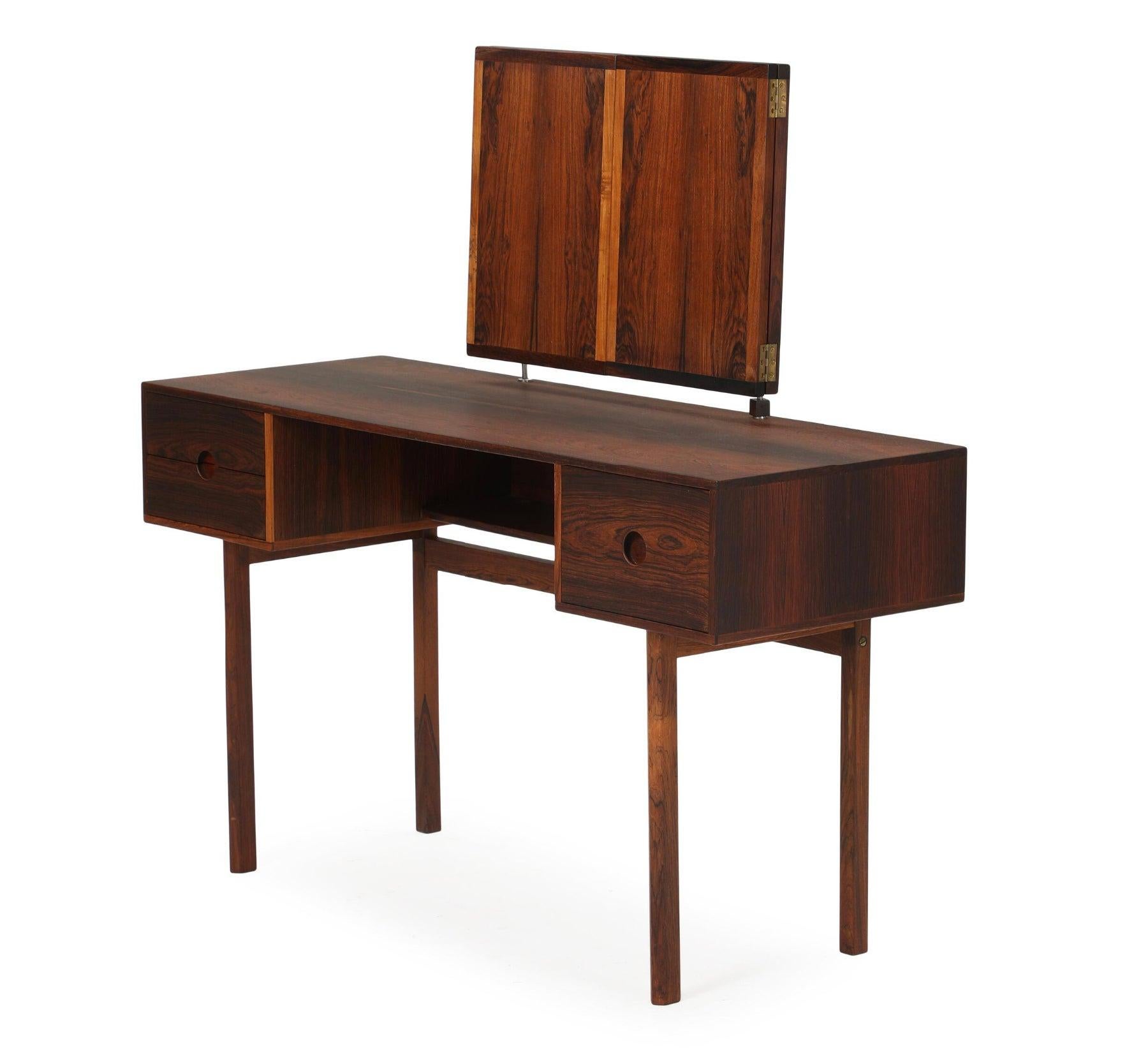 Kai Kristiansen Model 40 Rosewood Dressing table with folding 3-piece mirror. This dressing table was made from highly figured exotic rosewood by Aksel Kjersgaard in Denmark. Matching stool available by request. Pictured in a good pre-restoration