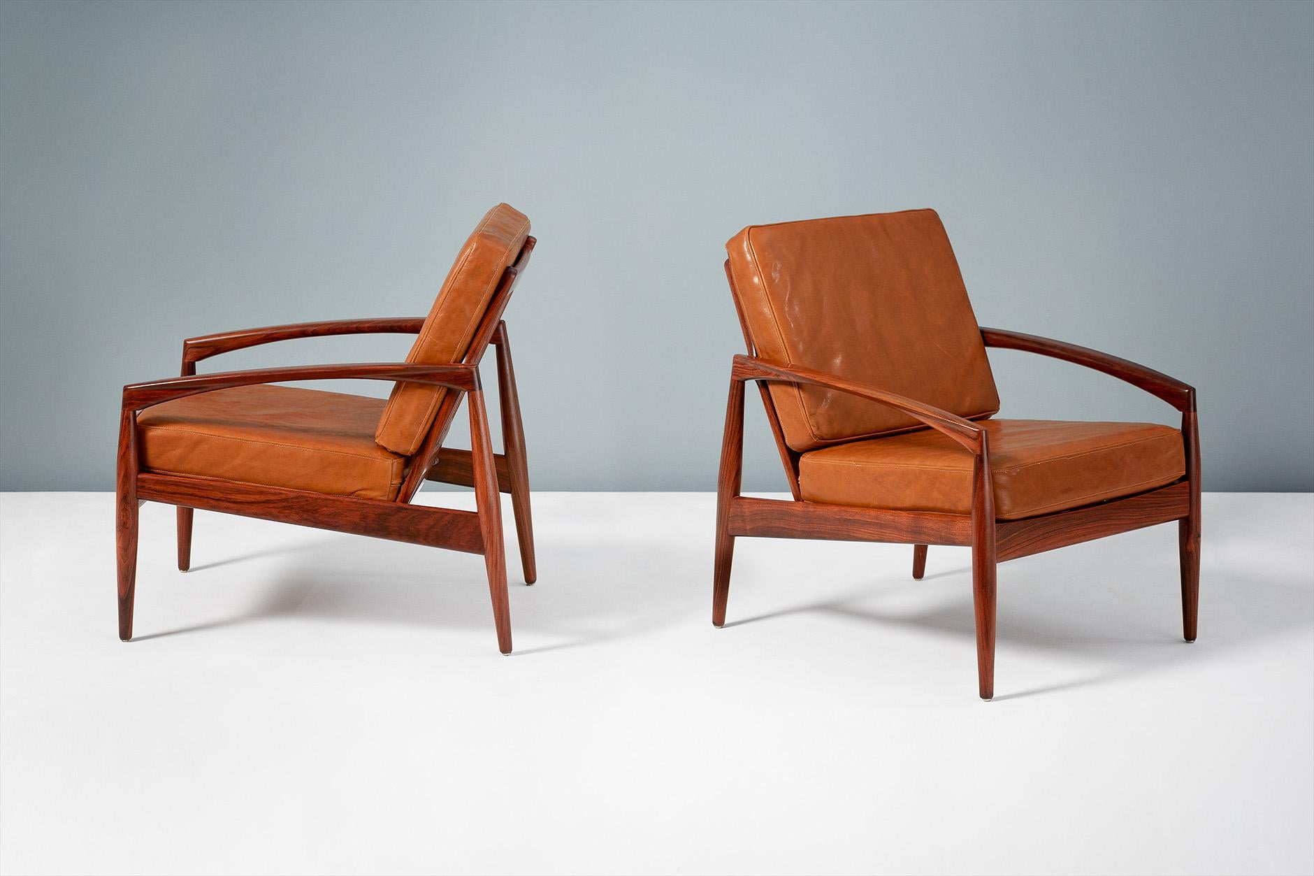 Kai Kristiansen

Model 121 paper knife lounge chairs, 1955

Pair of lounge chairs produced by Magnus Olesen, Denmark in rosewood. New cushions upholstered in premium cognac brown aniline leather. 

Measures: W 64cm, D 70cm, H 70cm

Other