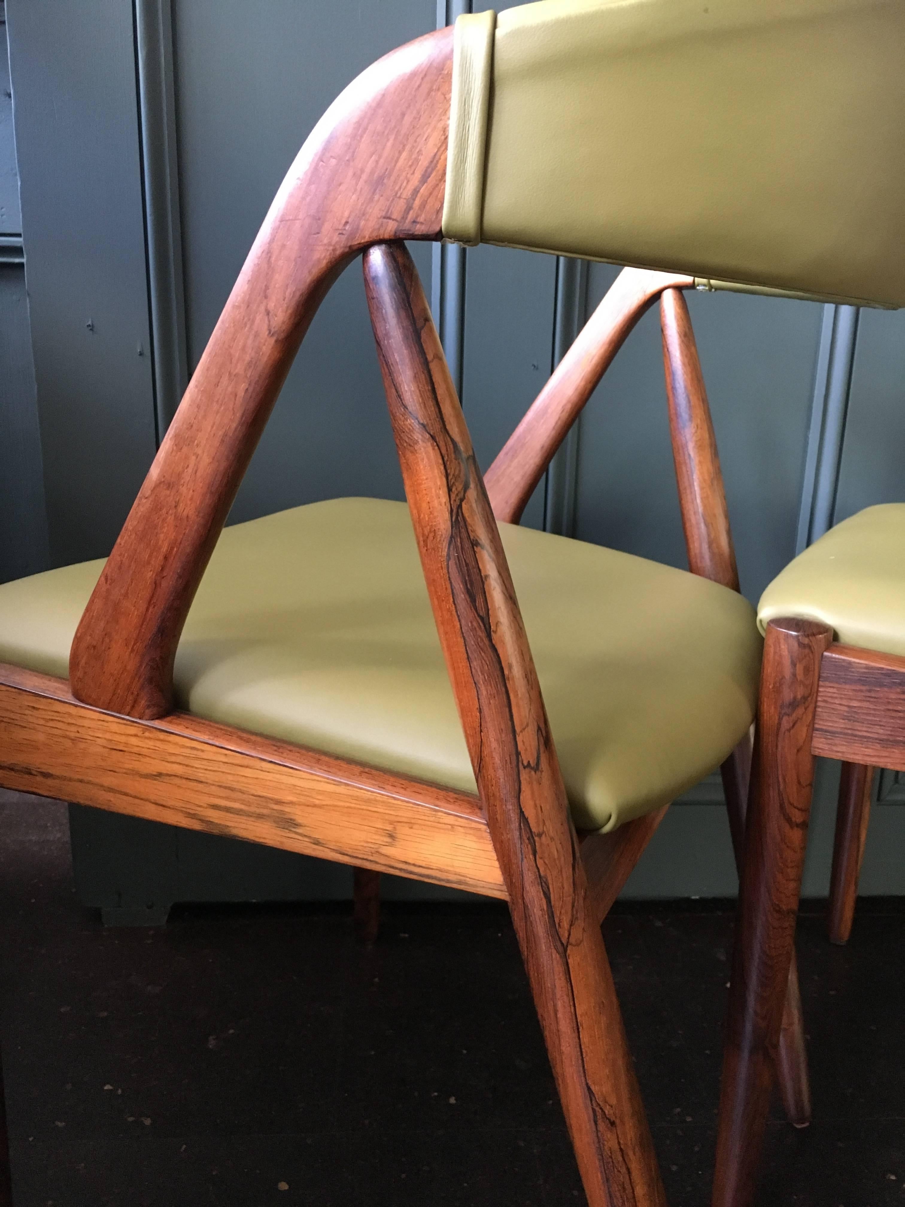 Set of six fully re-upholstered classic Kai Kristiansen model 31 dining chairs, Denmark, 1960.
Superb new Italian olive leather upholstery to contrast the beautifully grained rosewood frames.
We currently have more of these in stock if larger