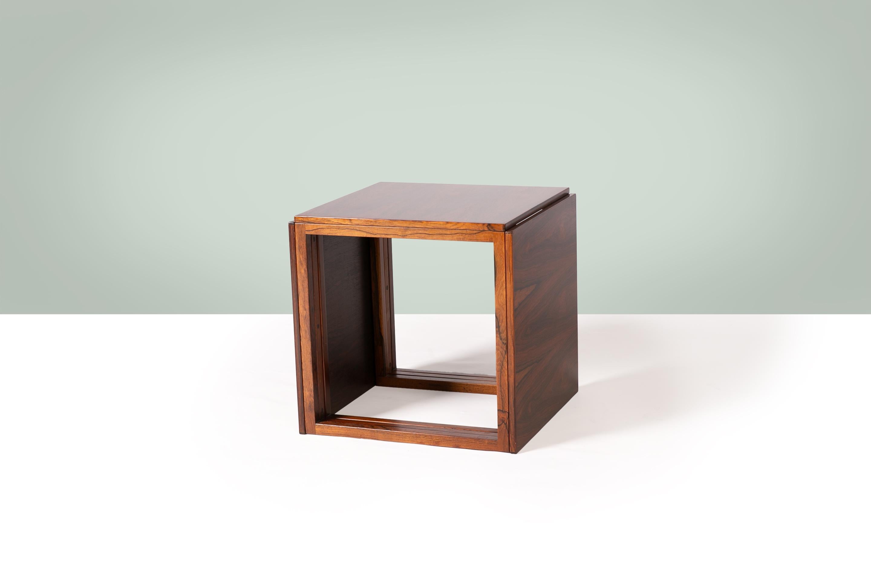 Kai Kristiansen rosewood ‘Cube’ Nest of Tables for Vildberg Møbelfabrik, Denmark 1960’s.

The Cube rosewood nest of tables, designed by Kai Kristiansen in the 1960s, exemplifies his mastery of minimalist design and functional elegance. Crafted from