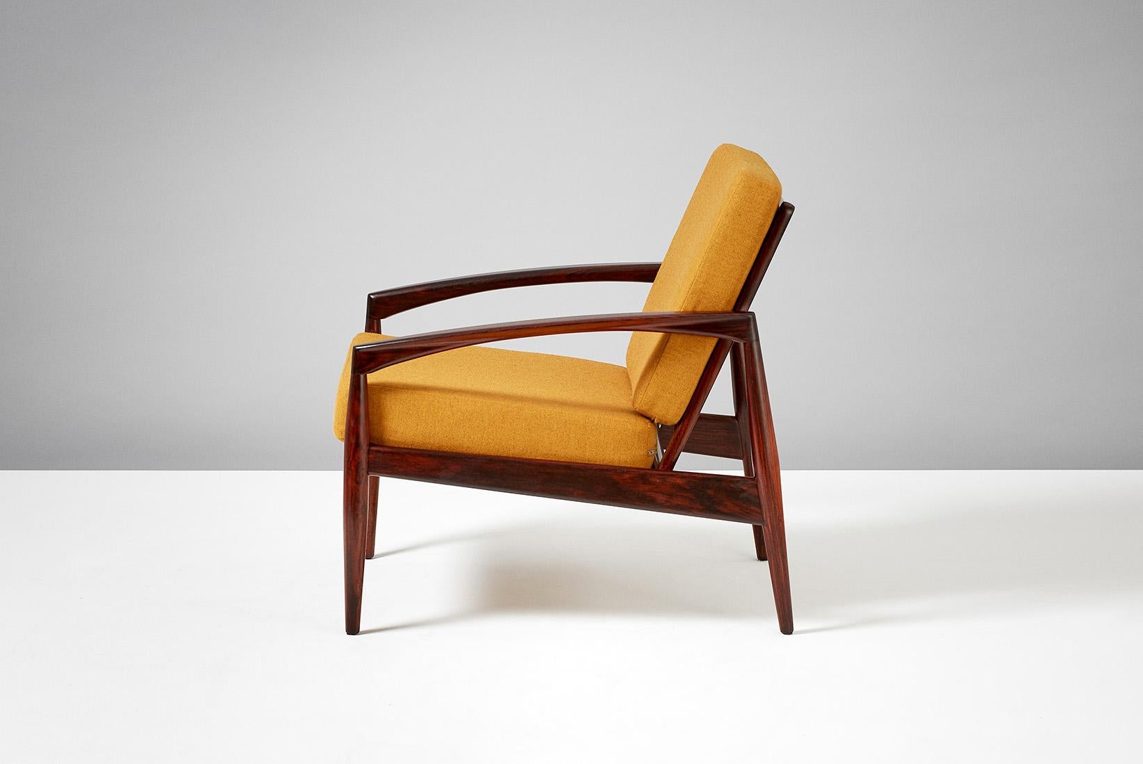 Kai Kristiansen

Paper Knife lounge chair, 1955.

Produced by Magnus Olesen, Denmark in solid rosewood. New cushions upholstered in yellow melange wool fabric from Kvadrat, Denmark. 

 

 