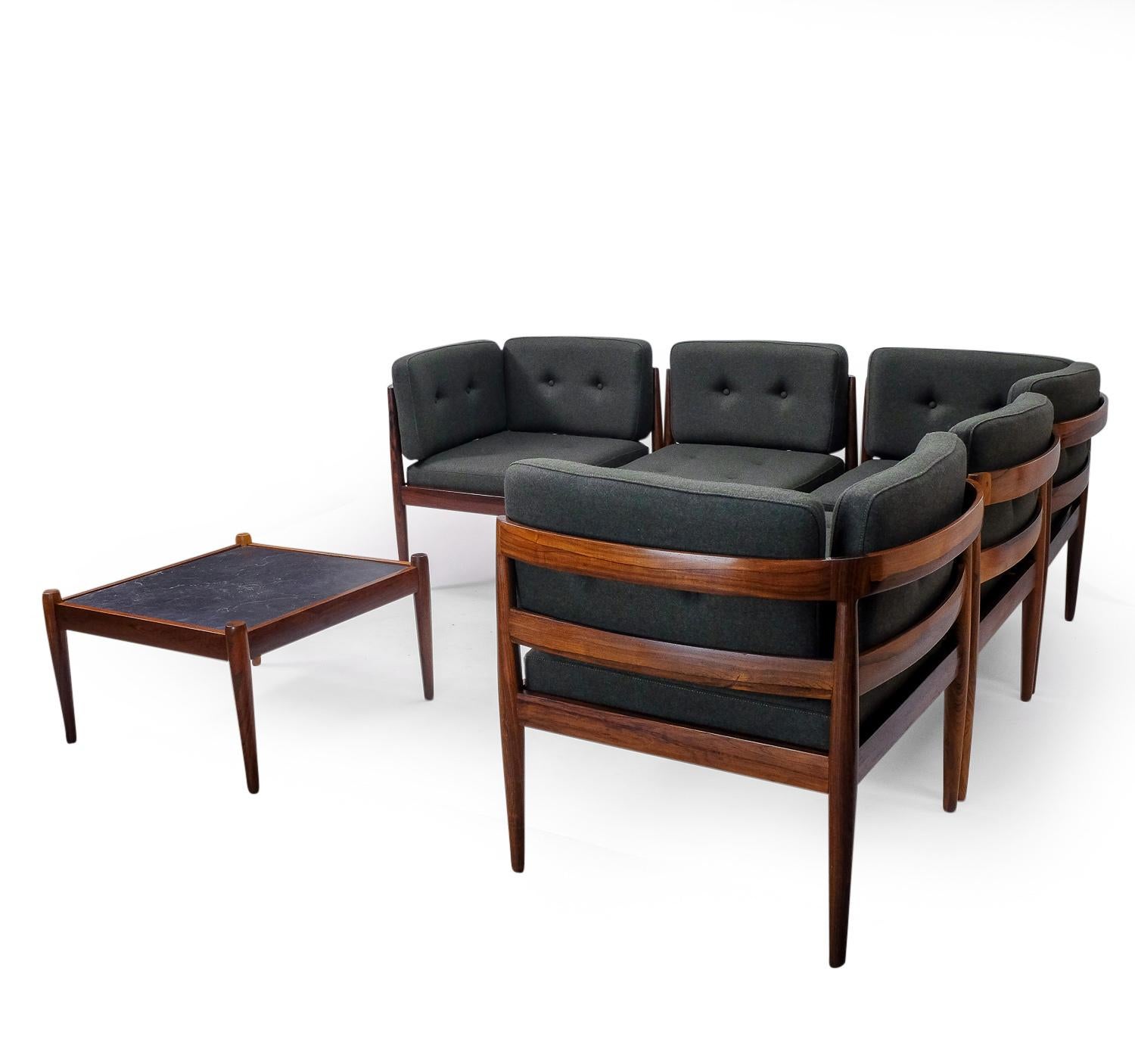 A rare seating arrangement designed by designer Kai Kristiansen for Magnus Olesen in Denmark.

This set has been made from Brazilian Rio Palisander and represents excellent craftsmanship as can be expected from Kai Kristiansen. The seats and table