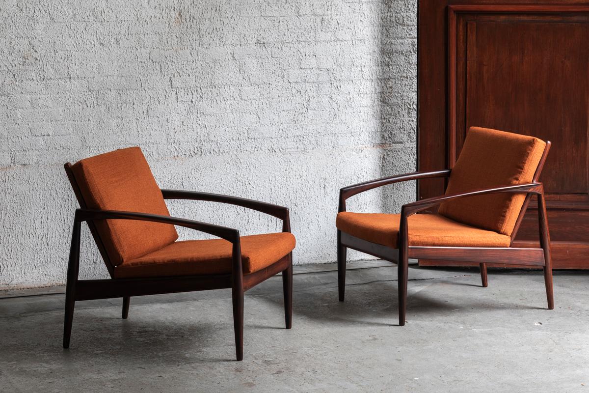 Set of 2 easy chairs, designed by Kai Kristiansen and produced by Magnus Olesen in Denmark starting from 1955. These ‘model 121’s’ are also called the ‘Paper knife’ chairs because of their razor sharp lines, here executed in solid rosewood with