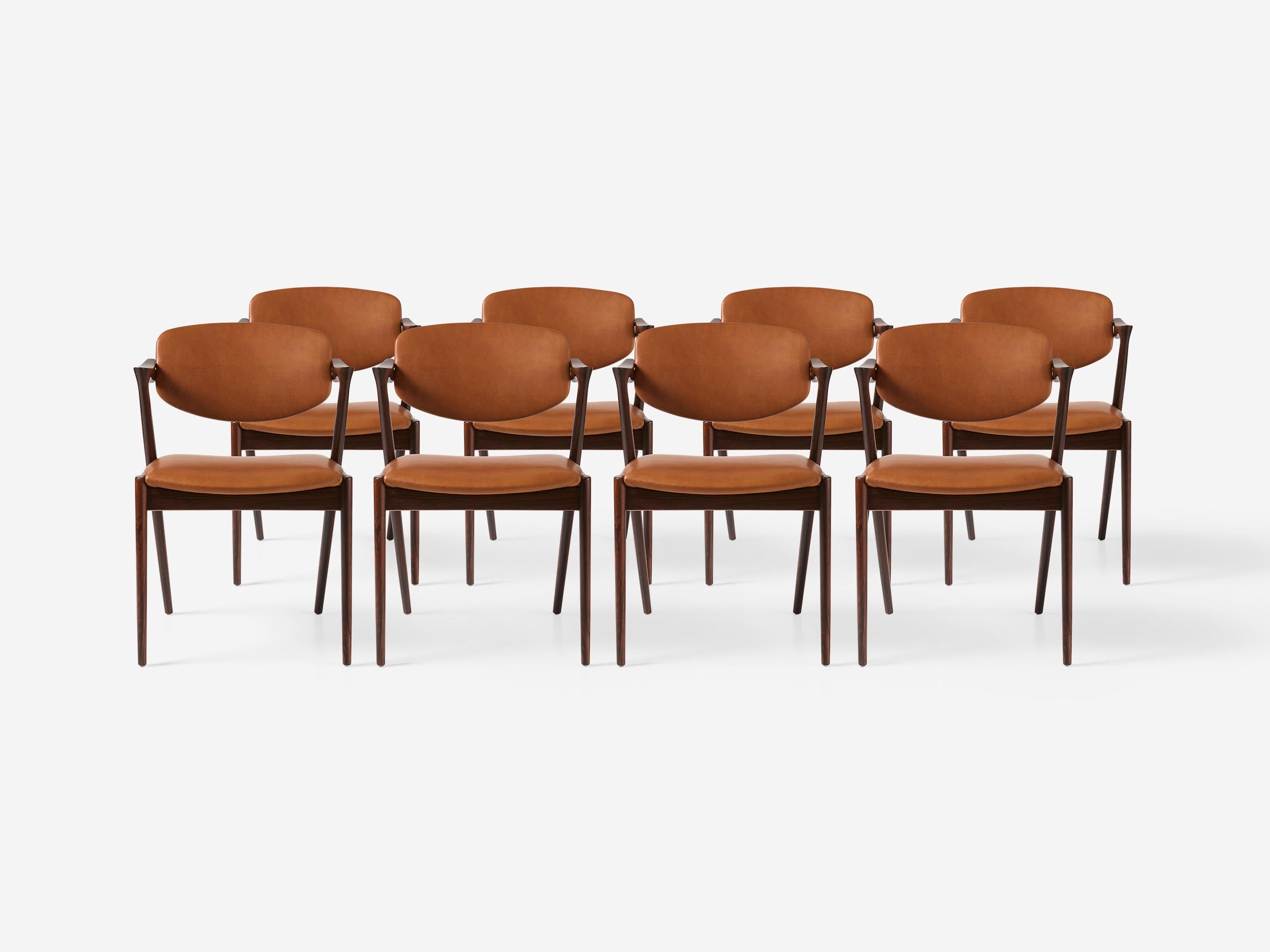 Kai Kristiansen - Model 42 Dining Chairs, 1956.

A set of 8 dining chairs produced by Skovman Andersen for the Illum Bolighus department store in Copenhagen. The frames are made from the highest quality rosewood and have been professionally restored