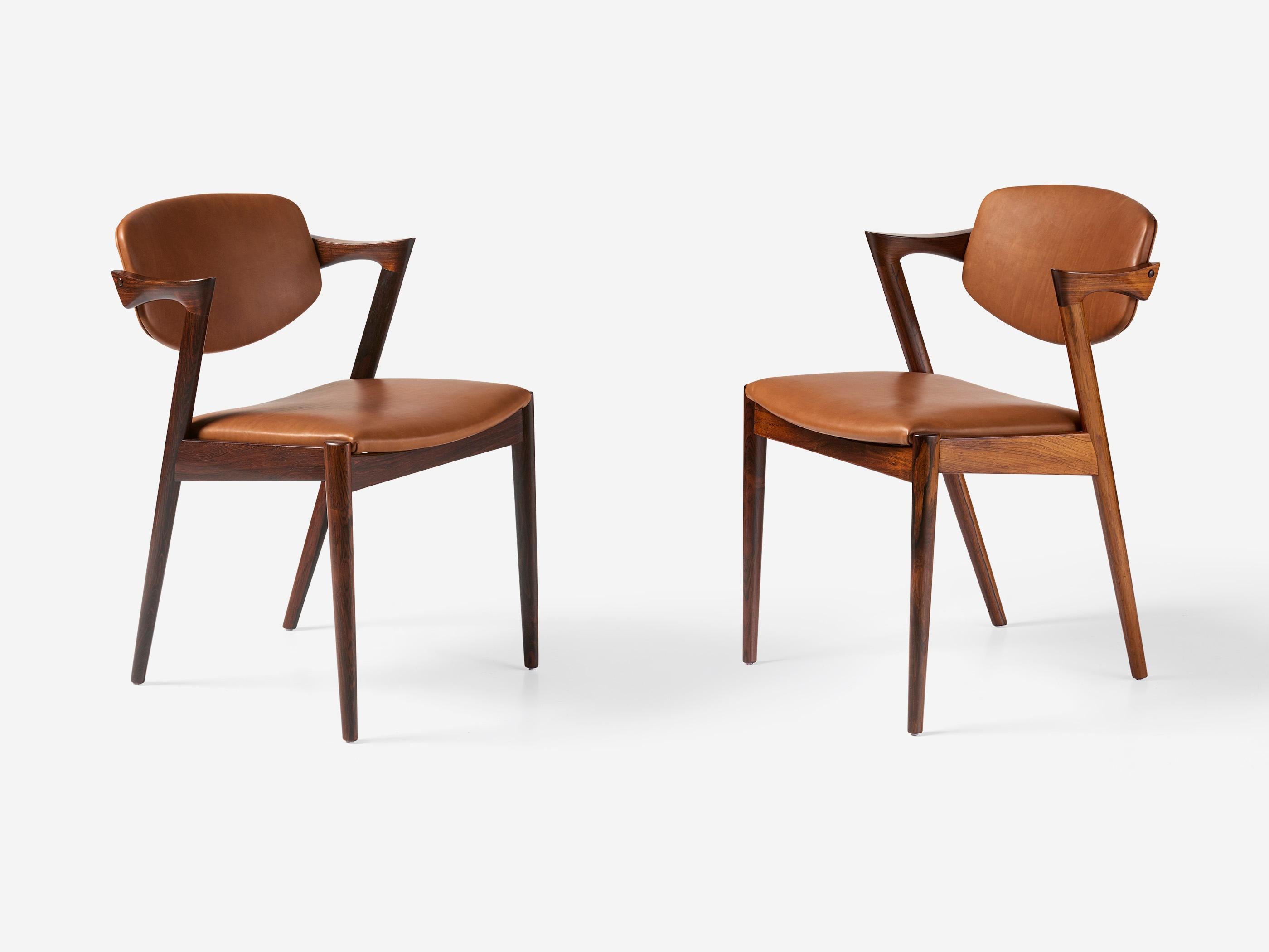 Kai Kristiansen Set of 8 Model 42 Rosewood and Leather Dining Chairs Escandinavo moderno en venta