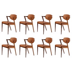 Kai Kristiansen lot de 8 chaises de salle à manger modèle 42 en bois de rose et cuir