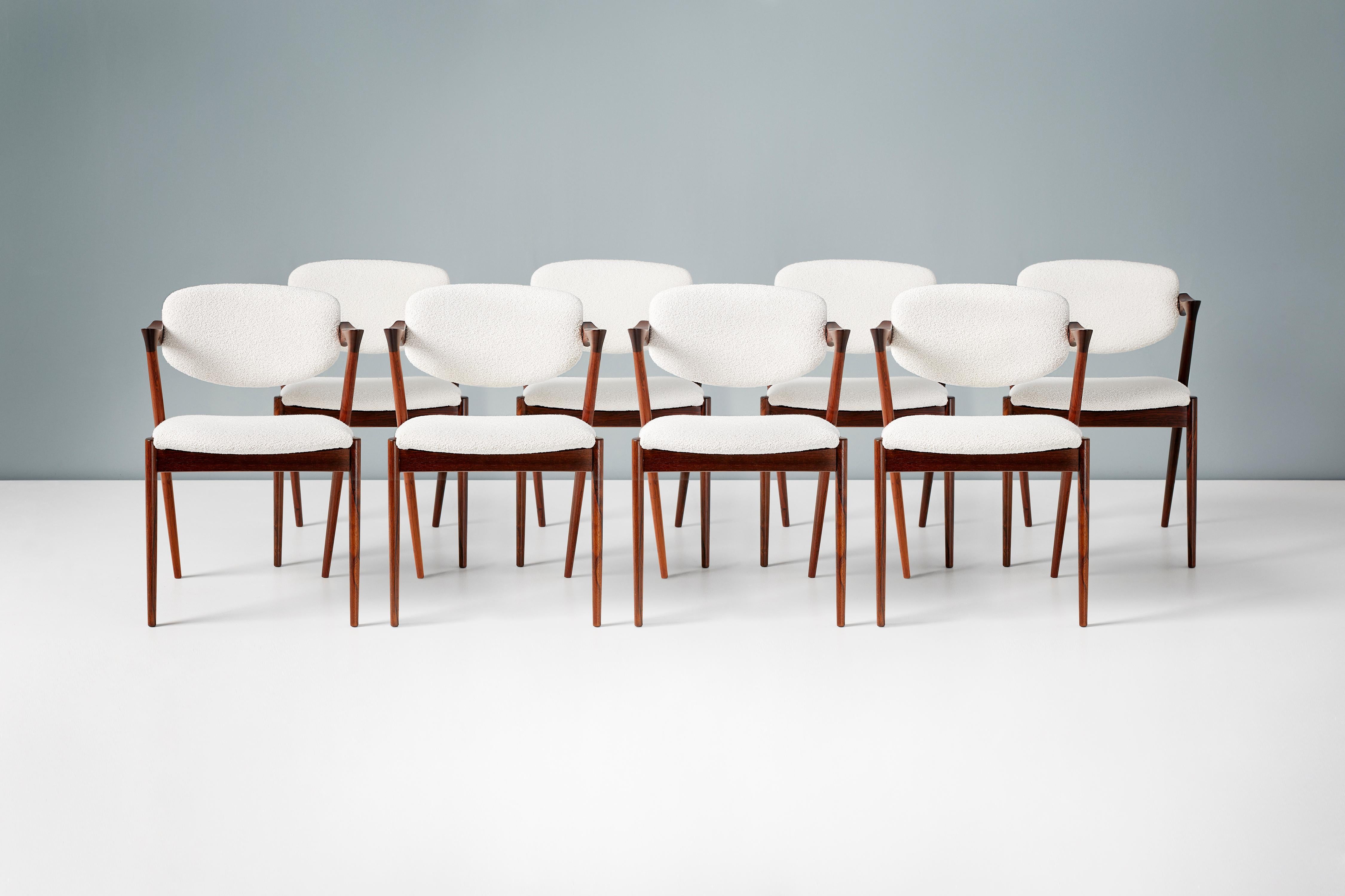 Kai Kristiansen

Model 42 dining Chairs, 1956.

Set of 8 dining chairs produced by Skovman Andersen for the Illum Bolighus department store in Copenhagen. The frames are made from the highest quality Brazilian rosewood which have been professionally