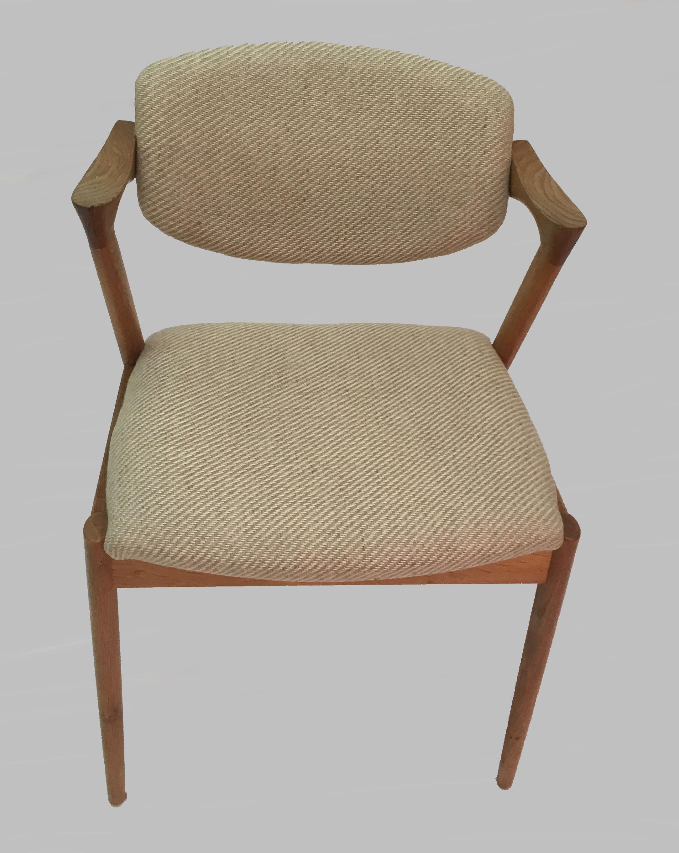 Set of eight restored and refinished dining chairs in oak with adjustable backrest by Kai Kristiansen for Schous Møbelfabrik.

The chairs have Kai Kristiansens typical light and elegant design that make them fit in easily where you want them in your
