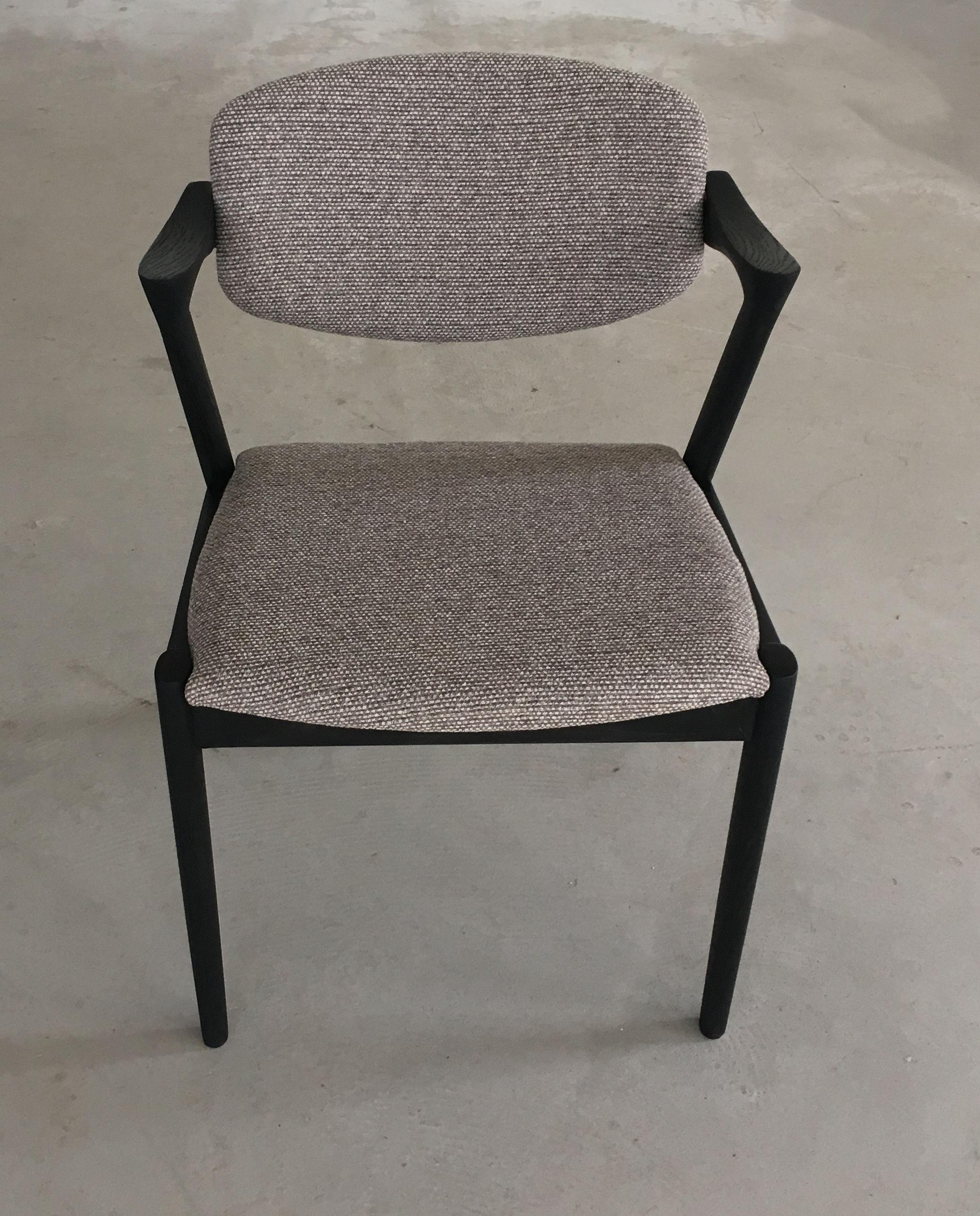 Set of 8 restored and ebonized oak dining chairs, inc. reupholstery with swivel backrest by Kai Kristiansen for Schous Møbelfabrik.

The chairs have Kai Kristiansen’s typical light and elegant design that make them fit in easily where you want them