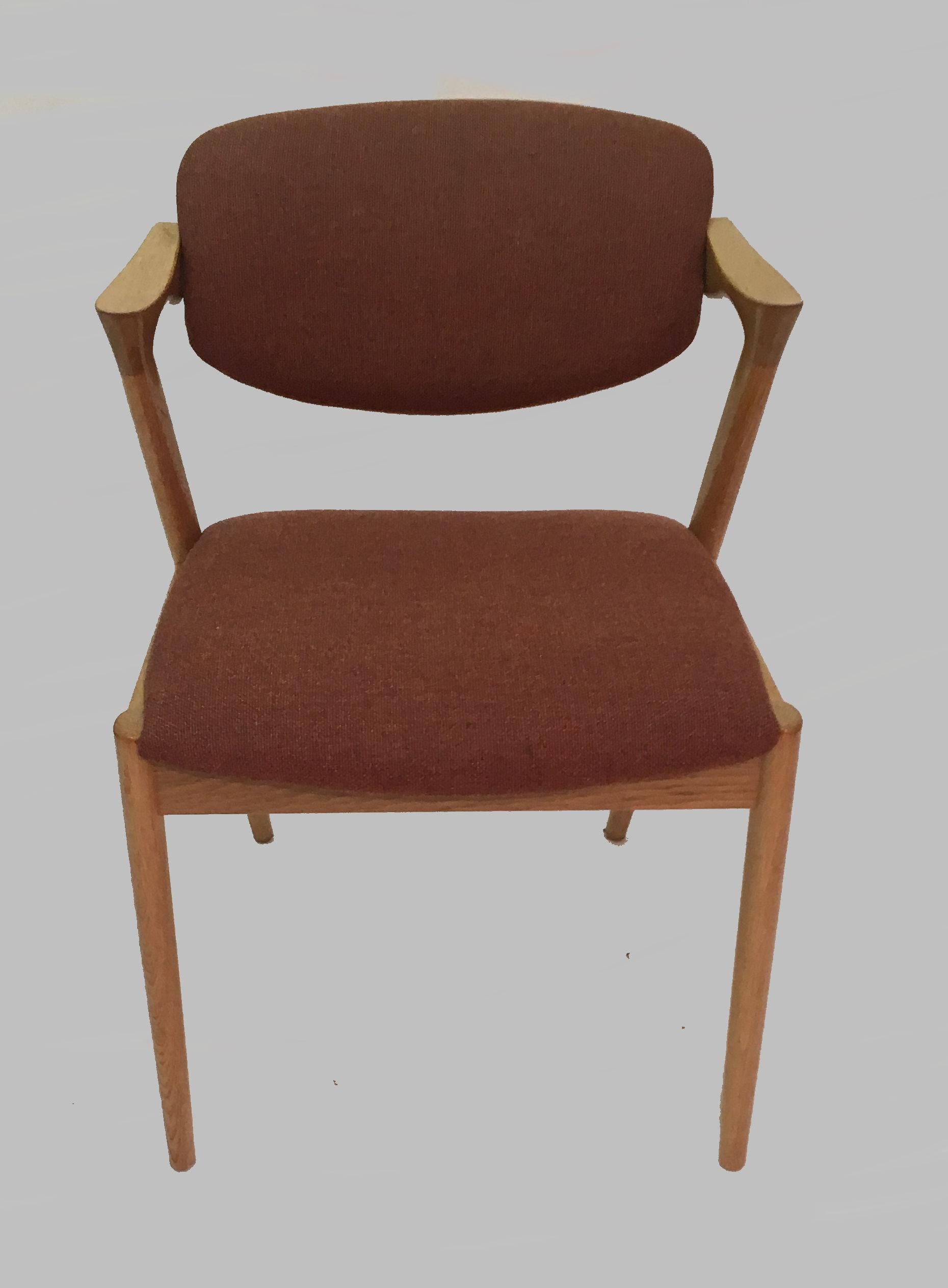Set of four restored dining chairs in oak with adjustable backrest by Kai Kristiansen for Schous Møbelfabrik.

The chairs have Kai Kristiansens typical light and elegant design that make them fit in easily where you want them in your home, a