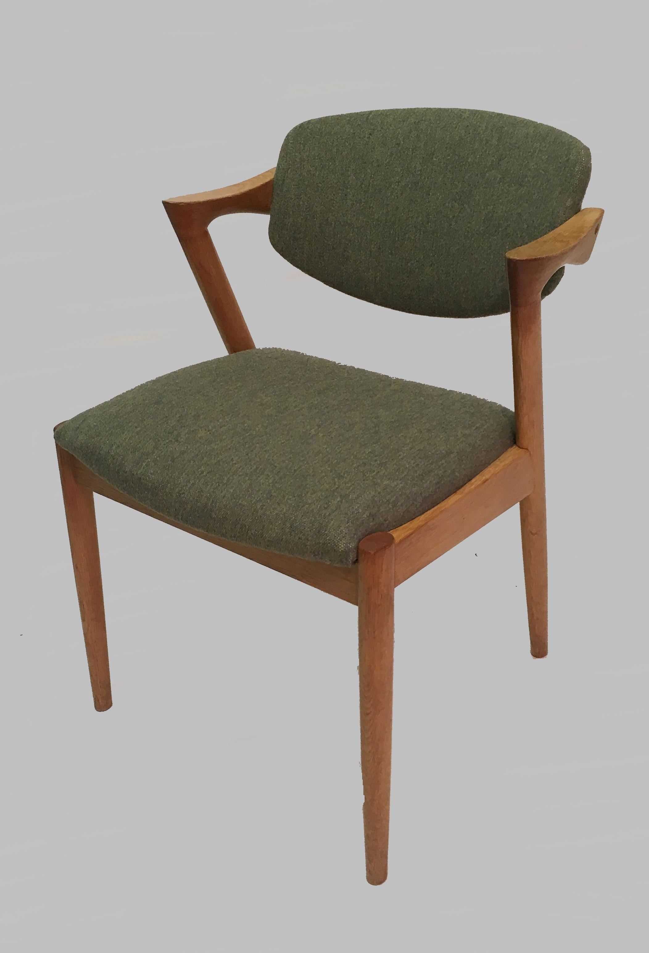 Set of ten fully restored and refinished model 42 dining chairs in oak with adjustable backrest by Kai Kristiansen for Schous Møbelfabrik.

The chairs have Kai Kristiansens typical light and elegant design that make them fit in easily where you want