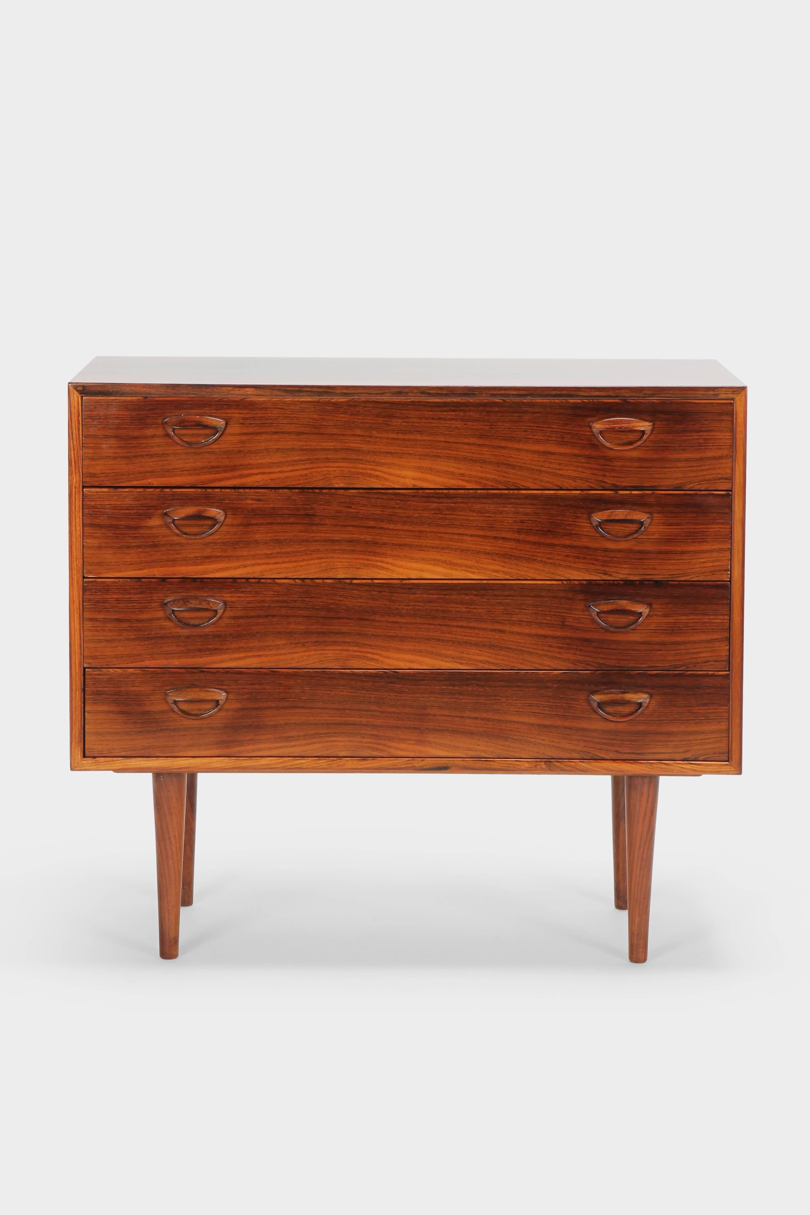 Kai Kristiansen sideboard manufactured by Feldballes Møbelfabrik in the 1960s in Denmark. Very elegant rosewood sideboard with four drawers and beautiful figured wooden grain details. Newly laquered with a nice patina.