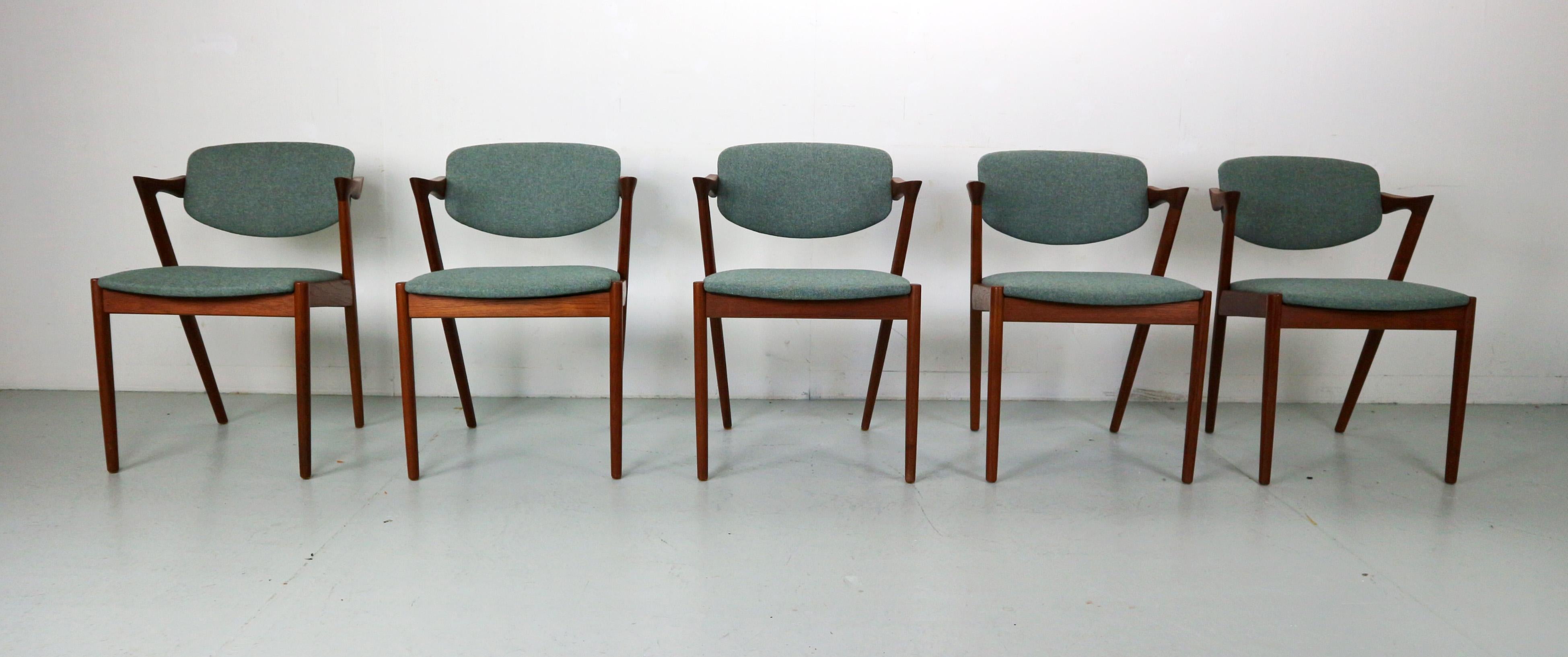 Set of five vintage dining chairs designed by Kai Kristiansen (Model 42). Produced in Denmark by Schou Andersen Møbelfabrik in the 60s. Frame made of teak and reupholstered in a high quality wool fabric by the Norwegian manufacturer Gudbrandsdalens