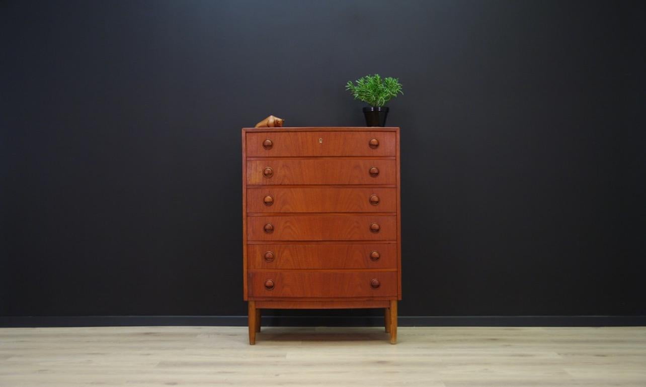 Cabinet from 1960s-1970s Minimalist form designed by Kai Kristiansen - Danish design. Surface veneered with teak. Six roomy drawers with remarkable handles made of solid teak. It does not have a key. Preserved in good condition (small dings and
