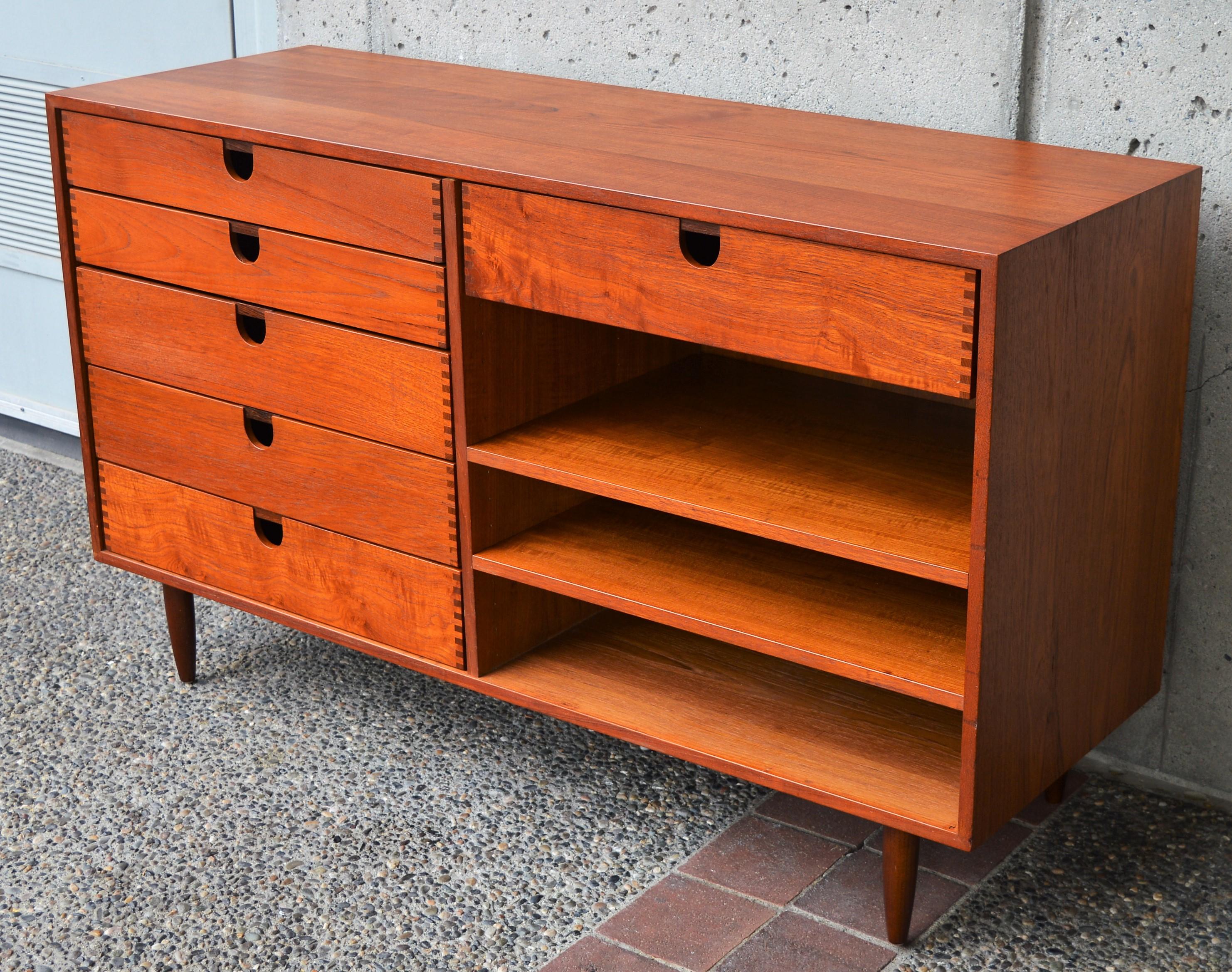 This super unique Danish modern teak credenza was designed by Kai Kristiansen for Feldballes Mobelfabrik. All of the drawers and shelves can be adjusted and moved where ever they suit or as your needs change as the drawer glides are removable. The