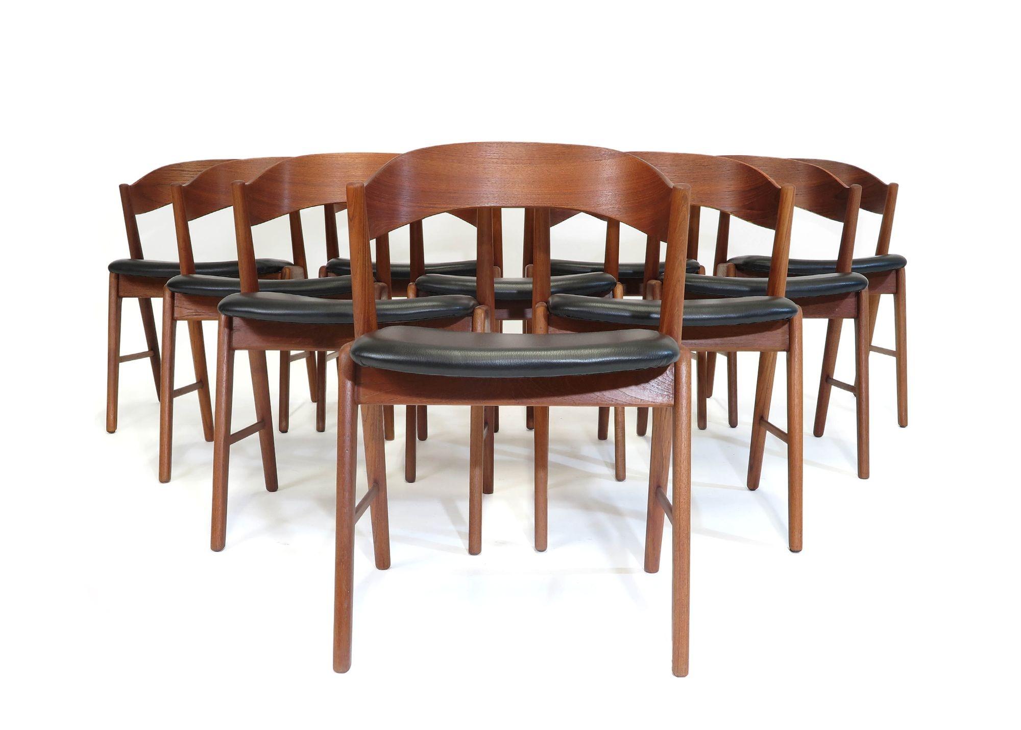 Set of ten midcentury Danish dining chairs designed by Kai Kristiansen, 1955, Denmark. The chairs are handcrafted of teak with dramatic curved backrest and cross stretcher. Perfectly restored frames in a natural oil finish, and newly upholstered