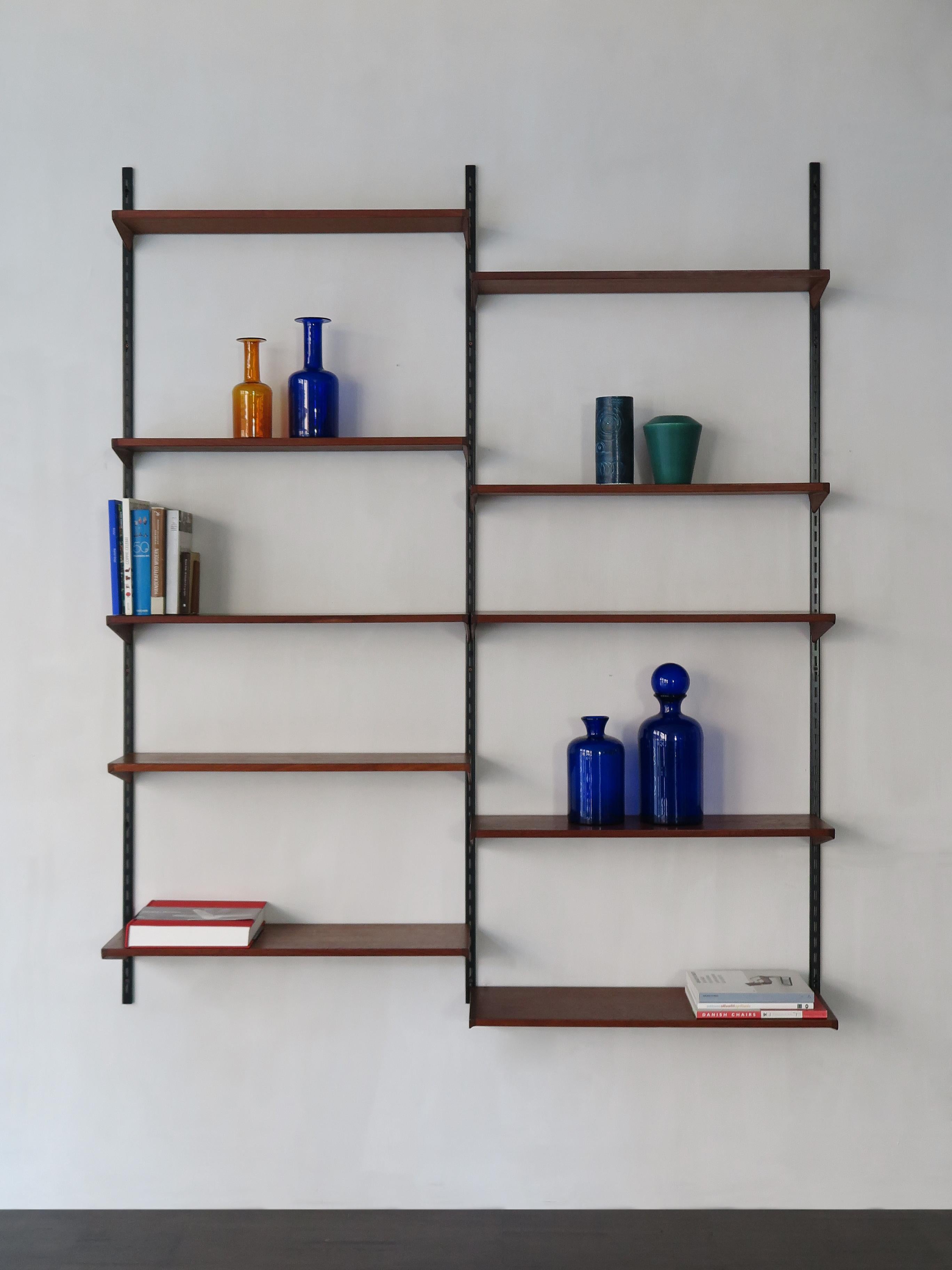 Scandinavian Mid-Century Modern design teak shelving system designed by Kai Kristiansen for FM Mobler Denmark, shelves can be positioned as desired, circa 1960.

Original rails with teak (see picture)

Please note that the item is original of
