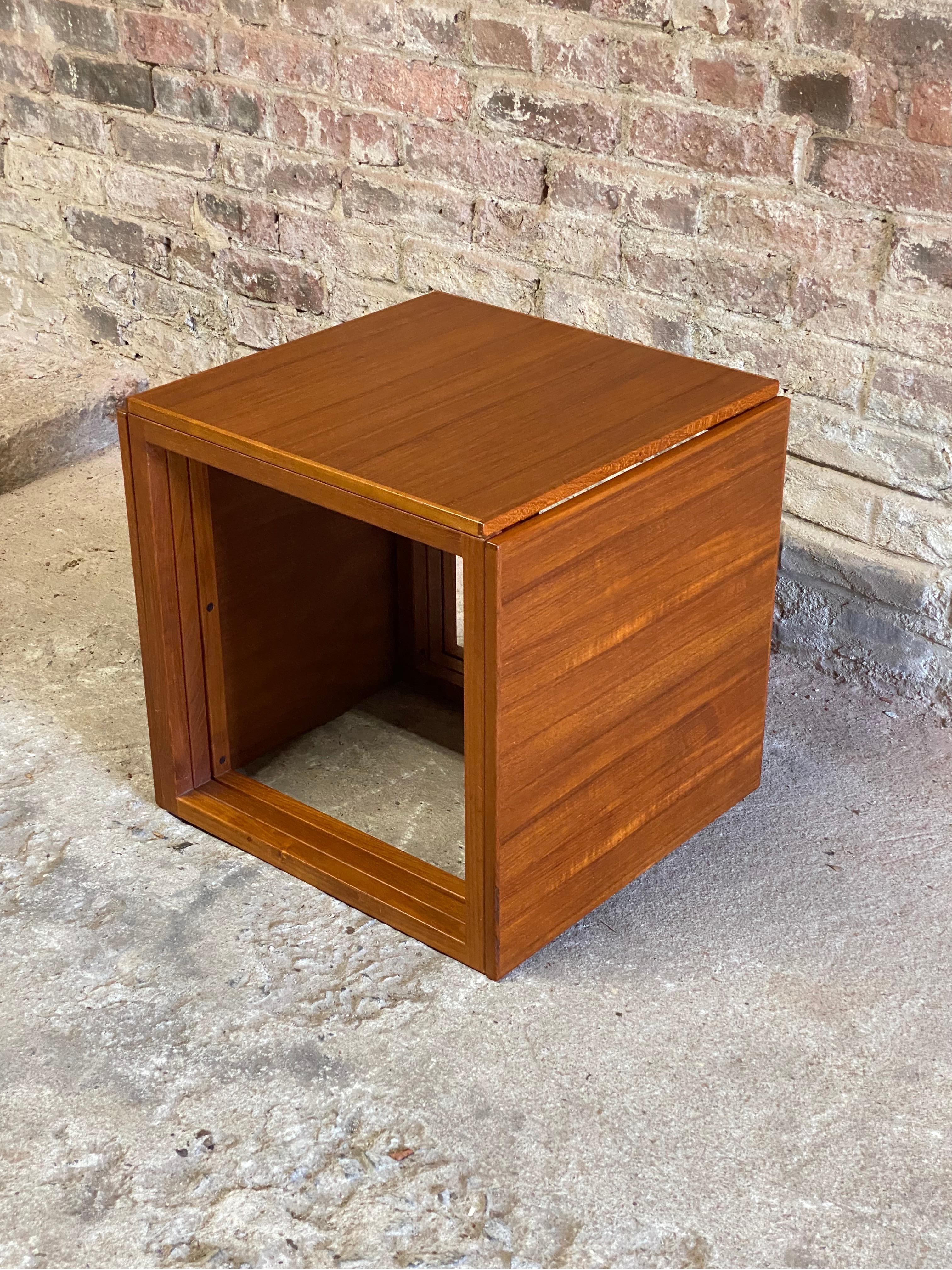 Kai Kristiansen for Vildbjerg Mobelfabrik. Made in Denmark. Nicely figured teak veneers, solid teak supports and ingenious interlocking design. Circa 1960-70. Fully signed on bottom, VM, Made in Denmark with Danish Control Mark. 

Structurally