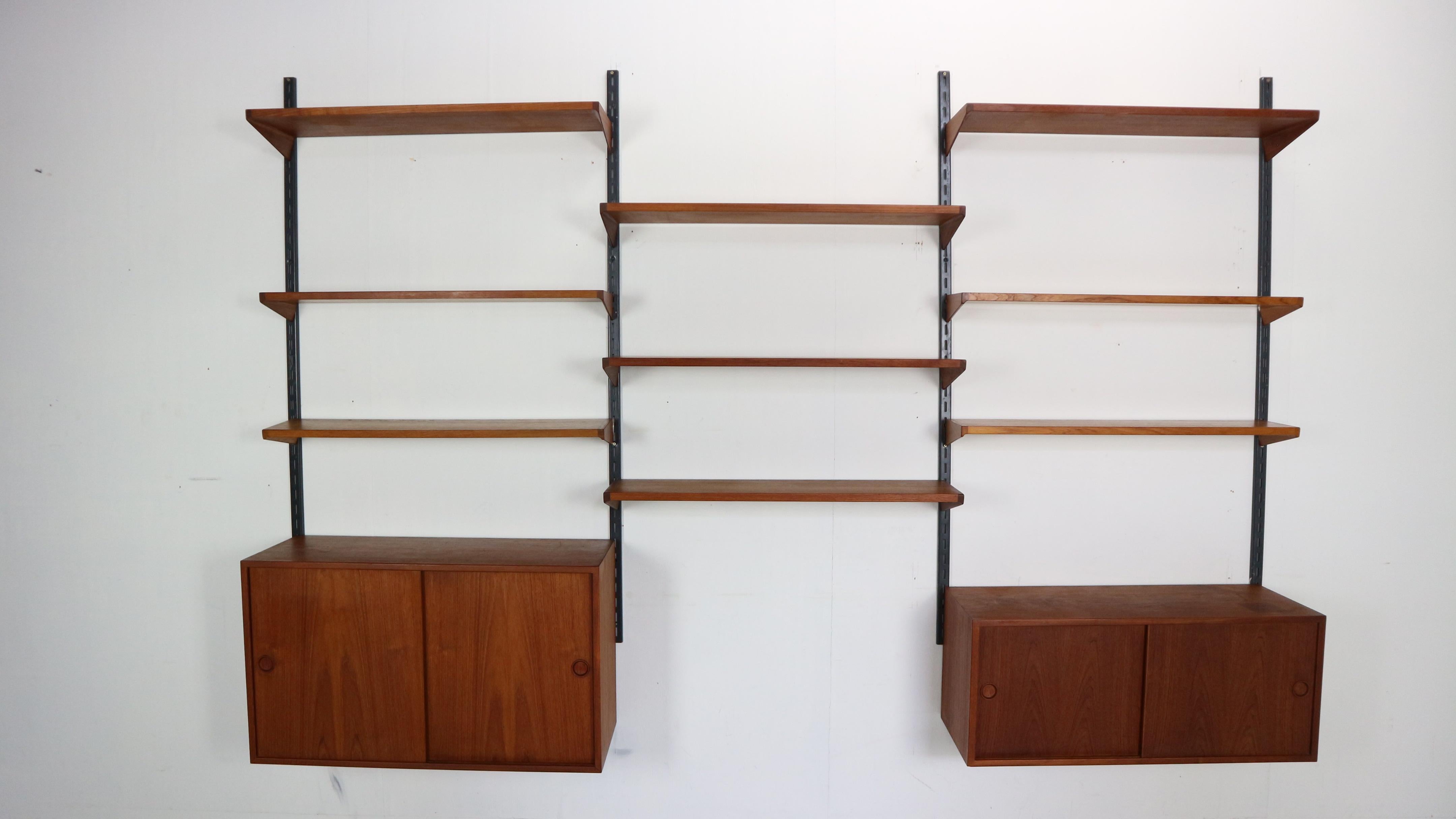 Mid-Century modern period famous danish furniture designer Kai Kristiansen design this gorgeous and very practical wall unit shelving system.
It was manufactured by Feldballes Møbelfabrik in 1960's period, Denmark.

Whole system is made of teak wood
