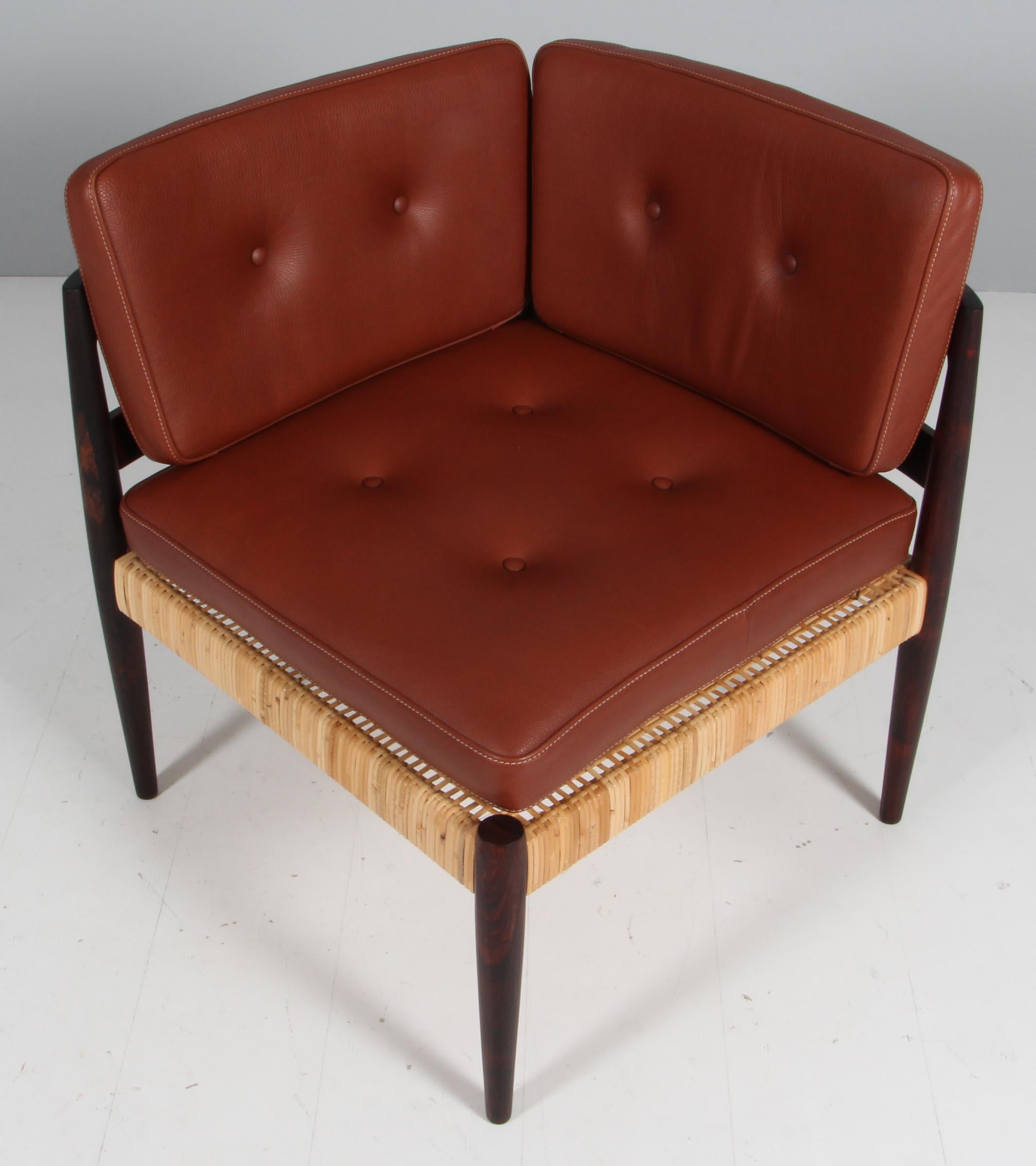 Kai Kristiansen Corner chair in rosewood, cane and leather cushion.

Model Univers, made by Magnus Olsen.