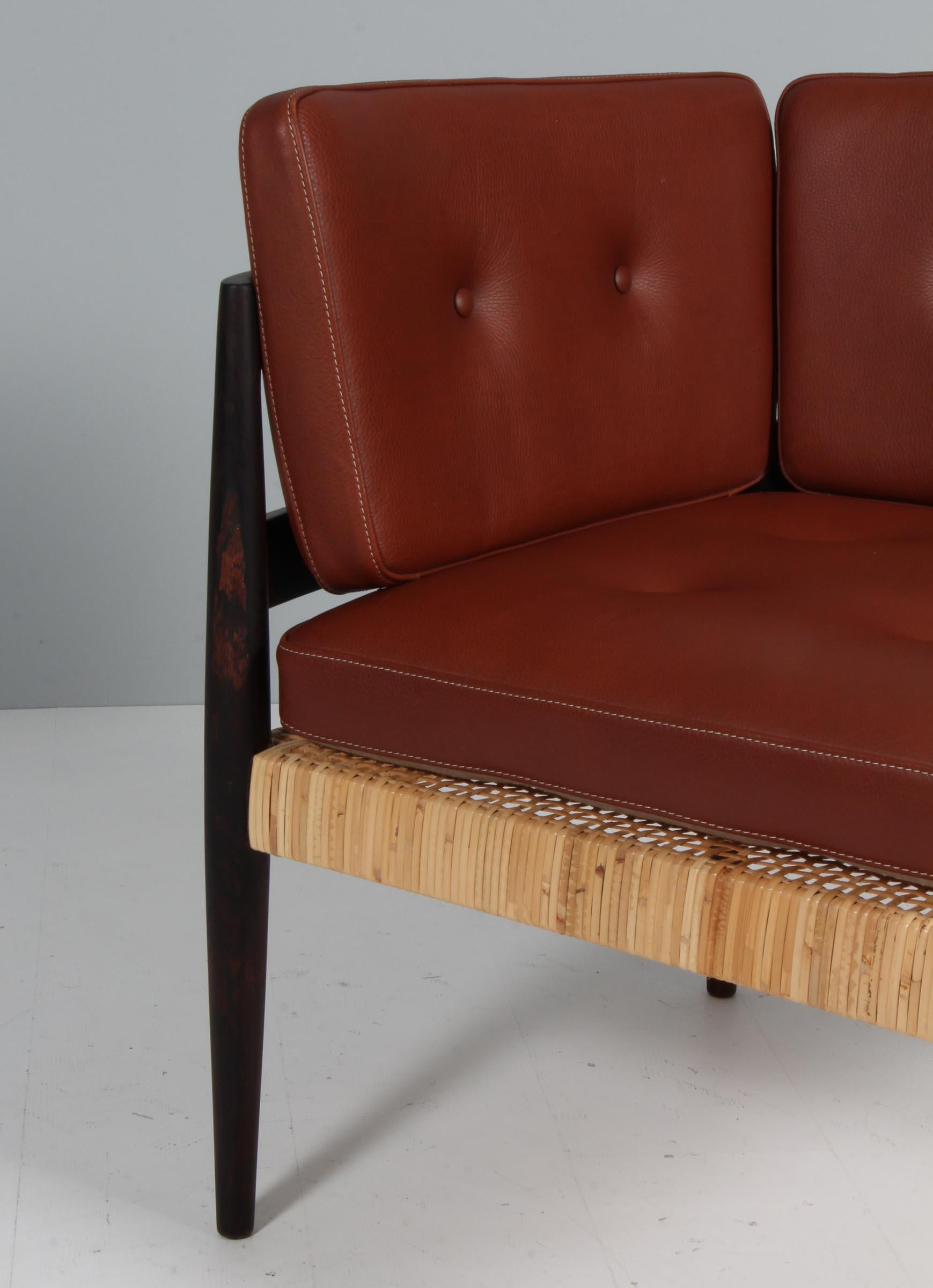Danish Kai Kristiansen Univers corner chair in leather, cane and rosewood For Sale