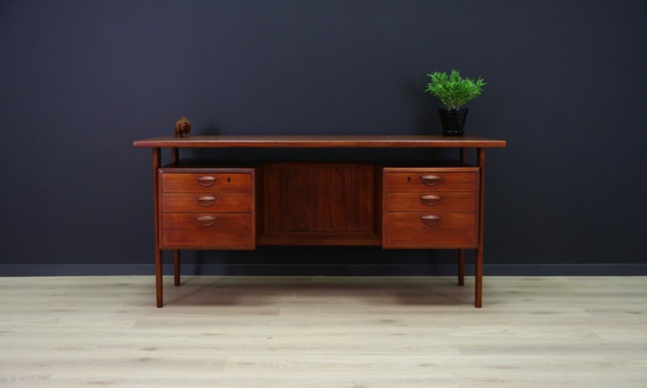 Unique desk from the 1960s-1970s, Danish design. A minimalist form designed by one of the most famous Danish designers - Kai Kristiansen. Finished with teak wood veneer. A practical front with six drawers, at the back a bookshelf. Preserved in good