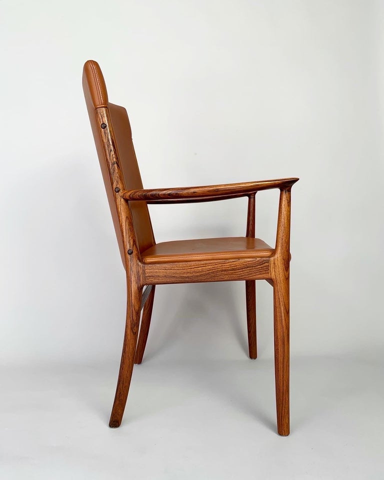 Kai Lyngfeldt Larsen armchair in rosewood & cognac colored leather, made by Søren Willadsen Møbelfabrik in Denmark in the 1960s.

Solid frame in rosewood with original leather upholstery with beautiful stitching.

Very good condition with normal