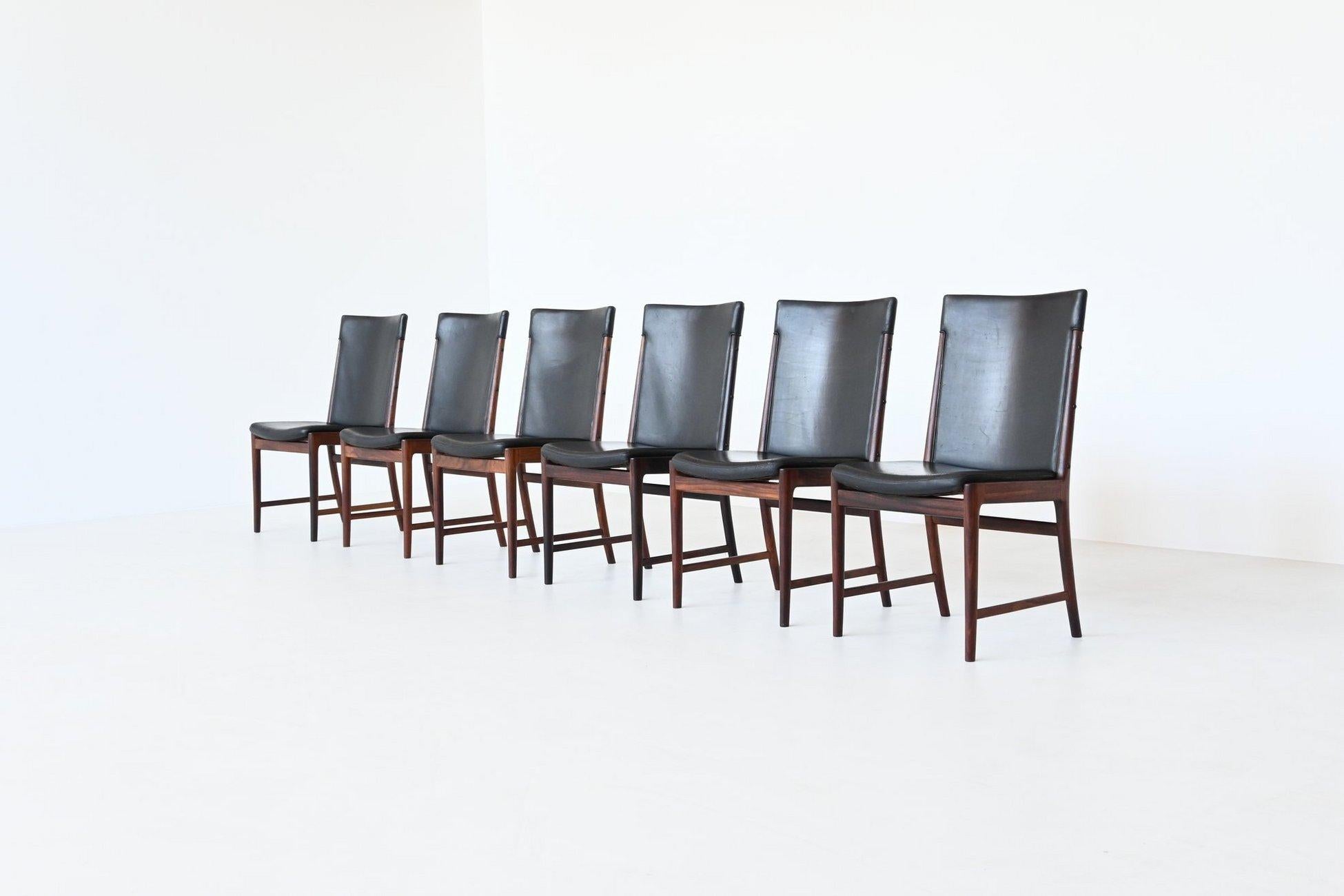 Stunning set of six beautiful shaped and well-crafted dining chairs designed by Kai Lyngfledt Larsen and manufactured by Søren Willadsen, Denmark 1960. These chairs are made of nicely grained solid Brazilian rosewood and the seats are upholstered