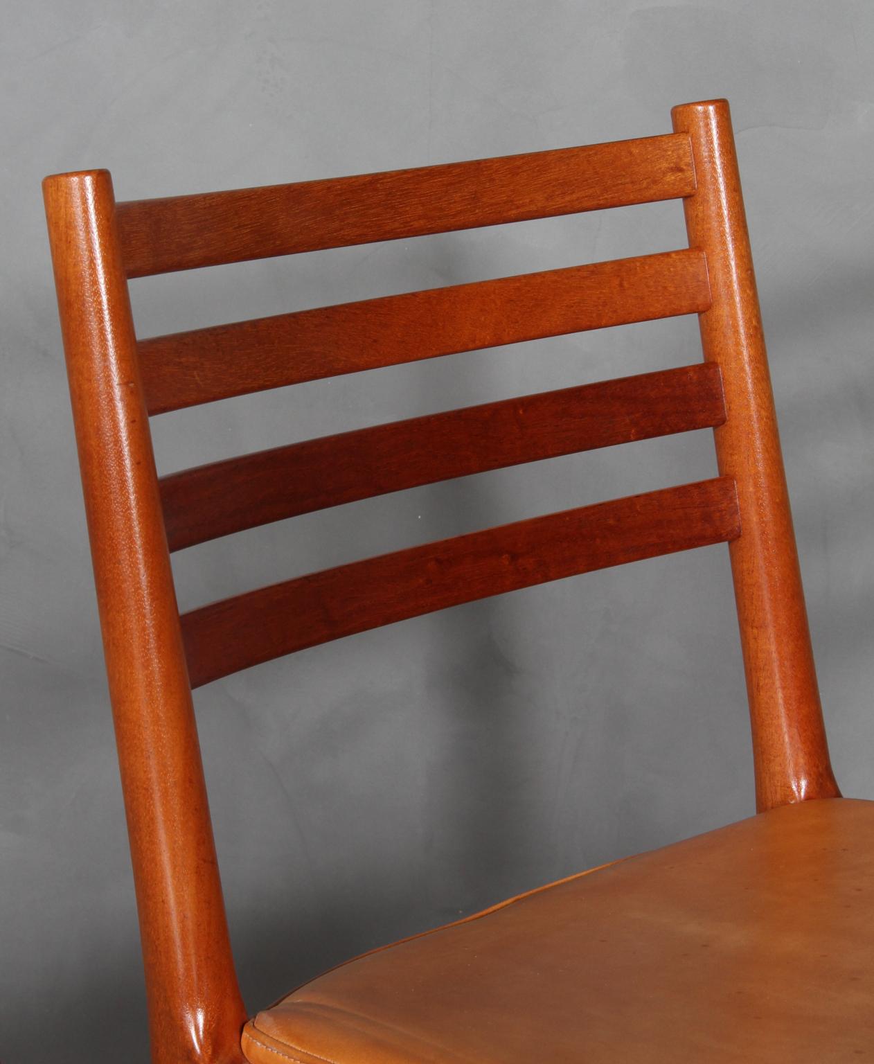 Scandinavian Modern Kai Lyngfeldt Larsen four dining chairs, mahogany and original Vegetal leather.