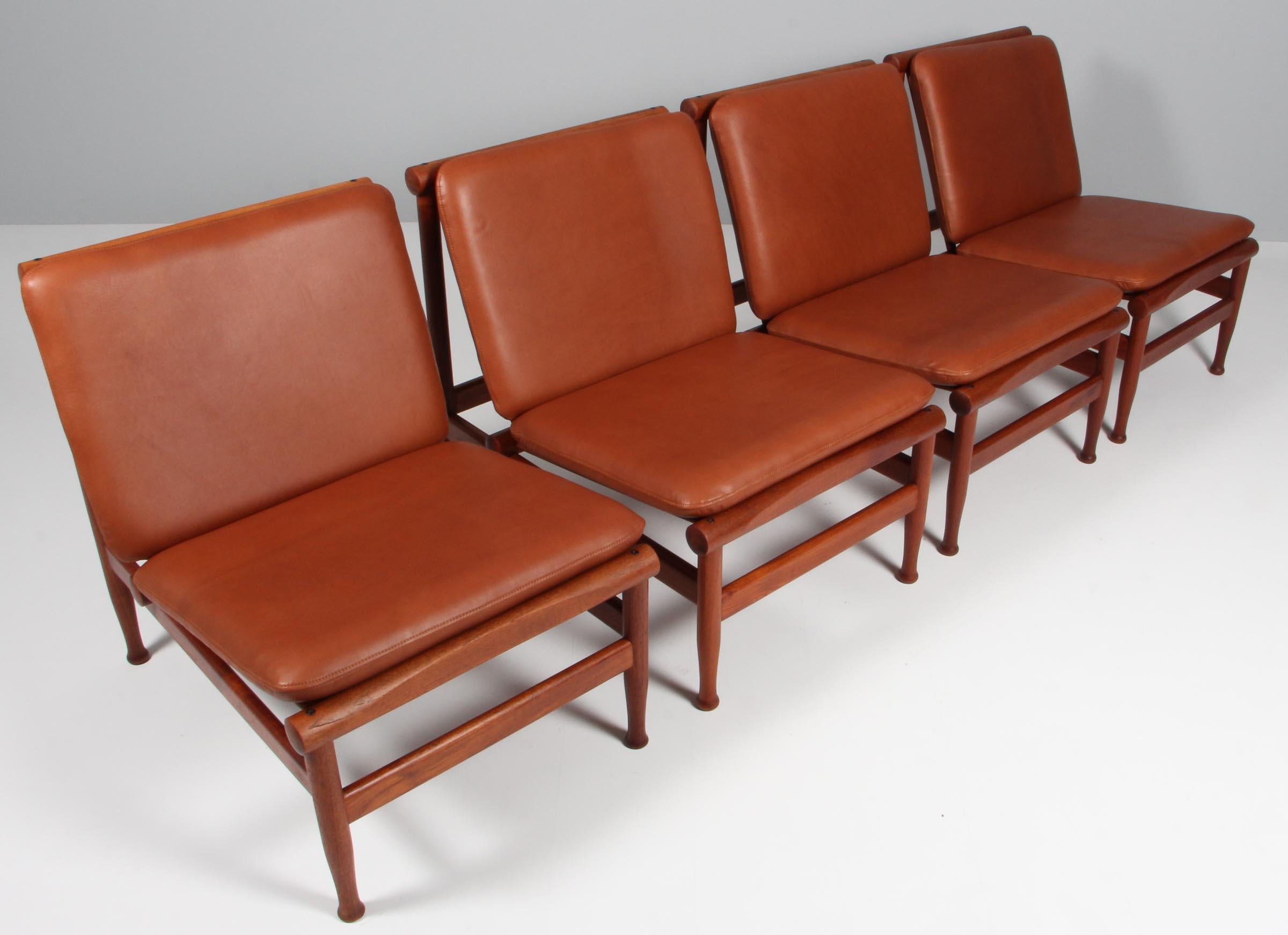 Kai Lyngfeldt Larsen lounge chairs in solid teak.

New upholstered with brandy coloured aniline leather.

Model 501, made by Søborg Møbler.

