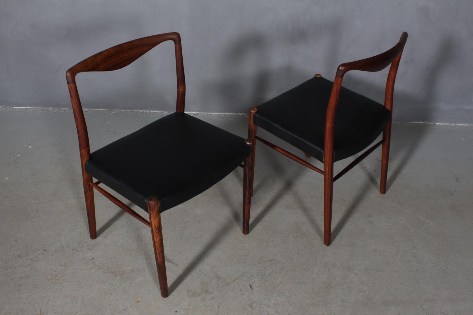 Kai Lyngfeldt Larsen side chairs in rosewood. 

New upholstered with black aniline leather.

Made by Søren Willadsen Vejen.