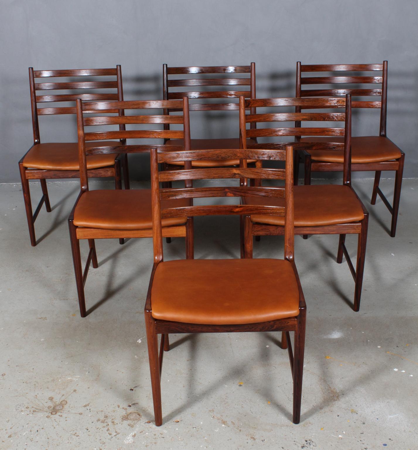 Kai Lyngfeldt Larsen six dining chairs. Solid rosewood frame.

New upholstered with cognac 