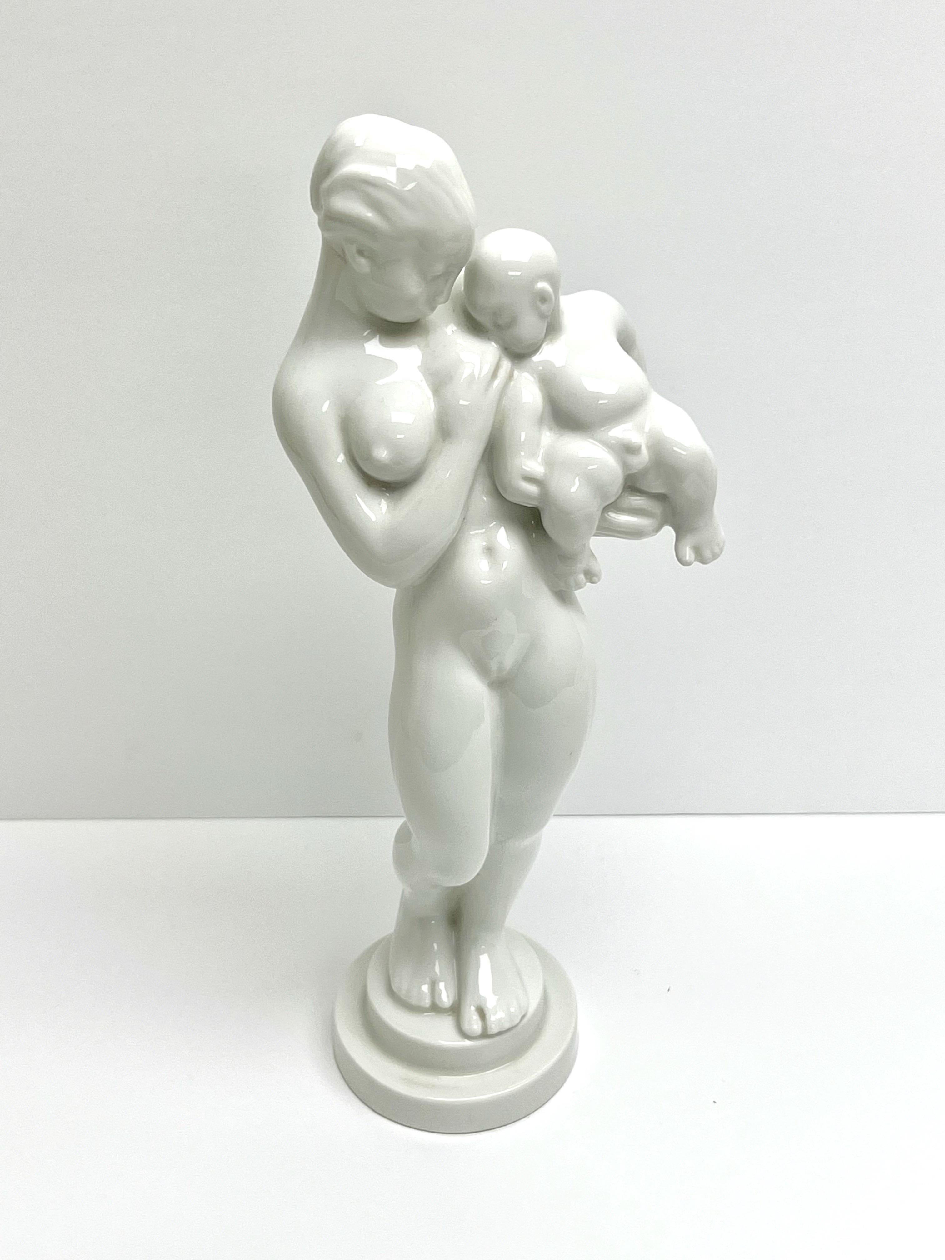 A Kai Nielsen B&G bland de chine porcelain figurine sculpture. A mother with baby.