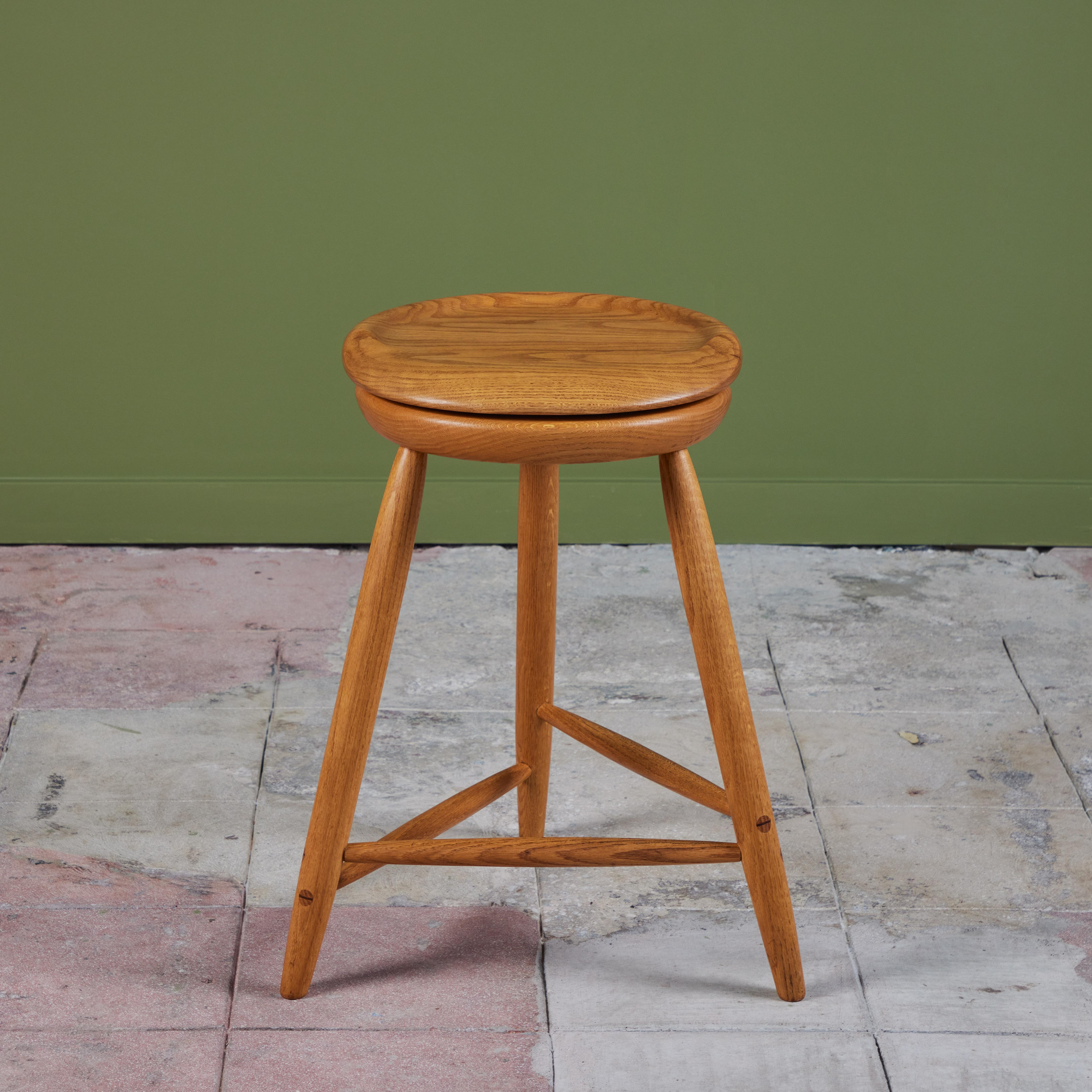 Studio craft stool made by Kai Pedersen c.1987s, USA. The oak stool showcases a minimalist design with a swivel seat and rounded edges. The stool is supported by three dowel legs with stretchers.
Signed Kai Pedersen - 1987.
2
